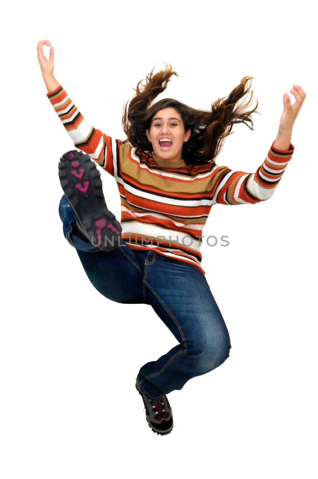 Beautiful teen jumping isolated in white