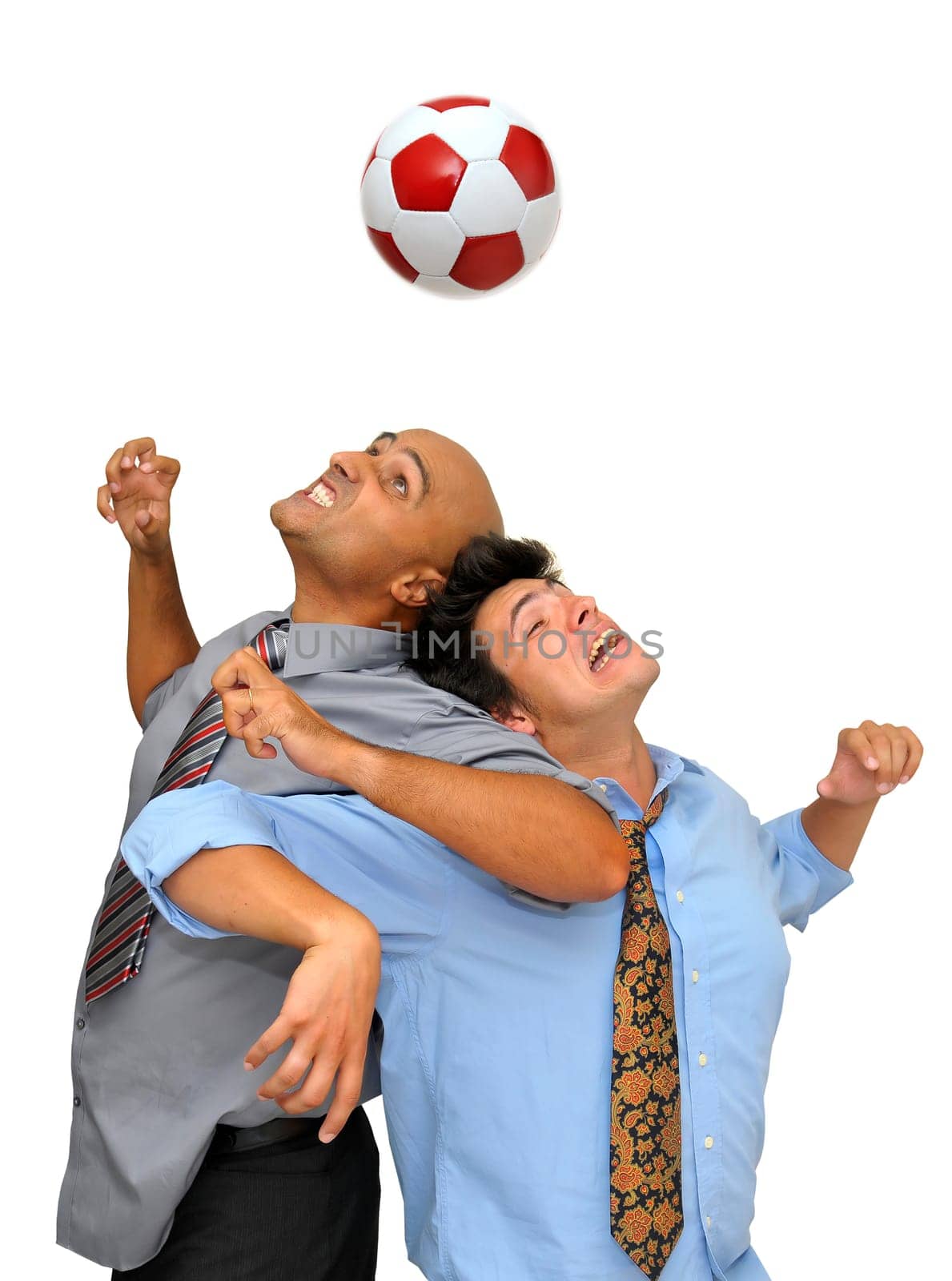 Two businessmen fighting for a ball header in a soccer game isolated in white