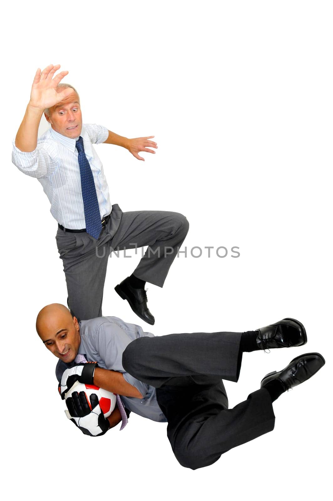 Two businessmen playing soccer isolated in white