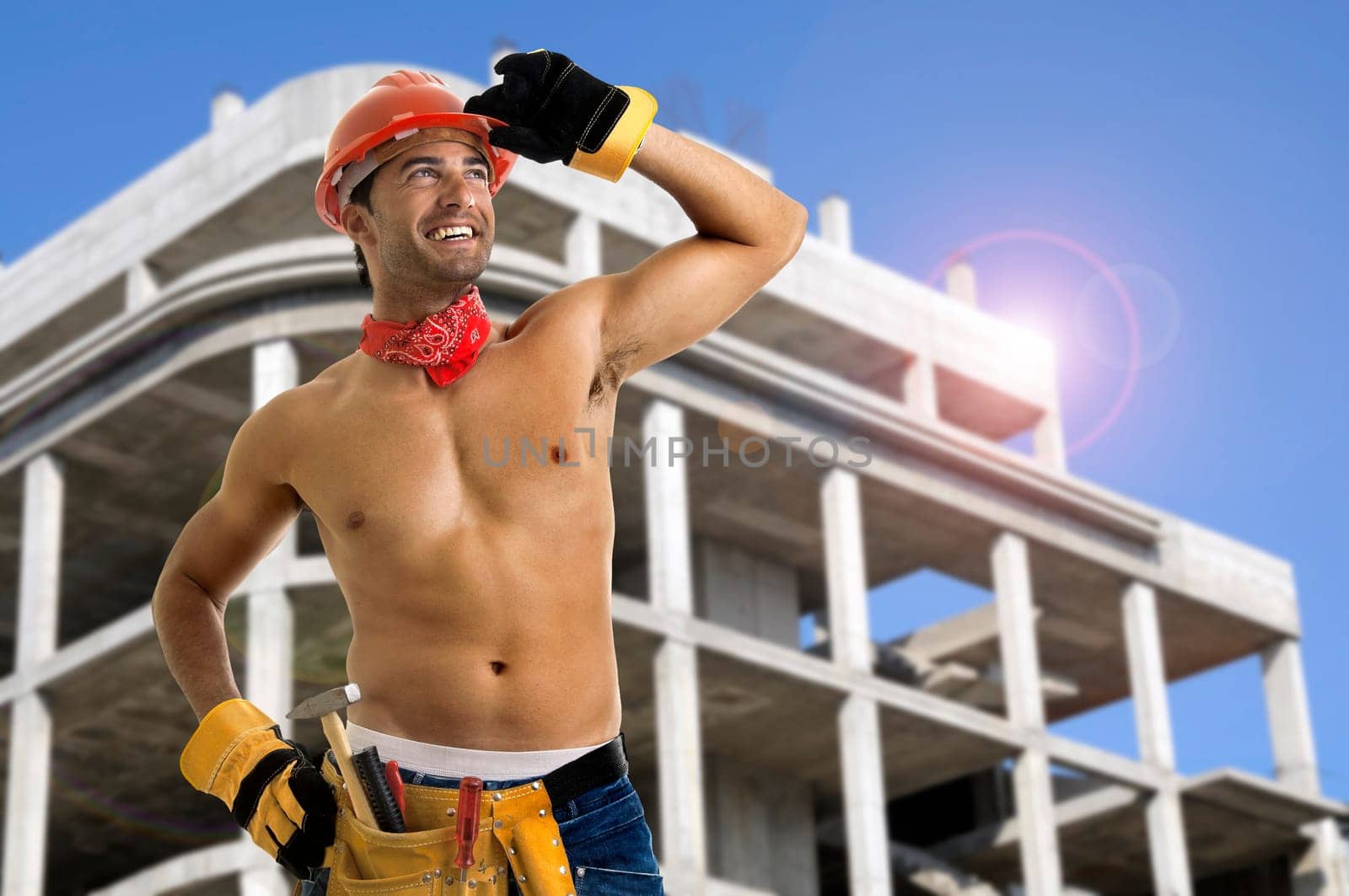 Strong build construction worker in a construction site