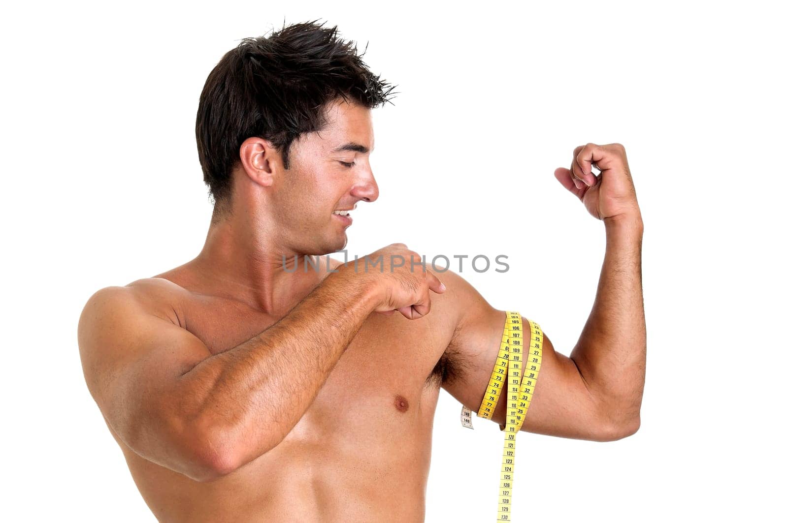 Muscular young man with measuring tape