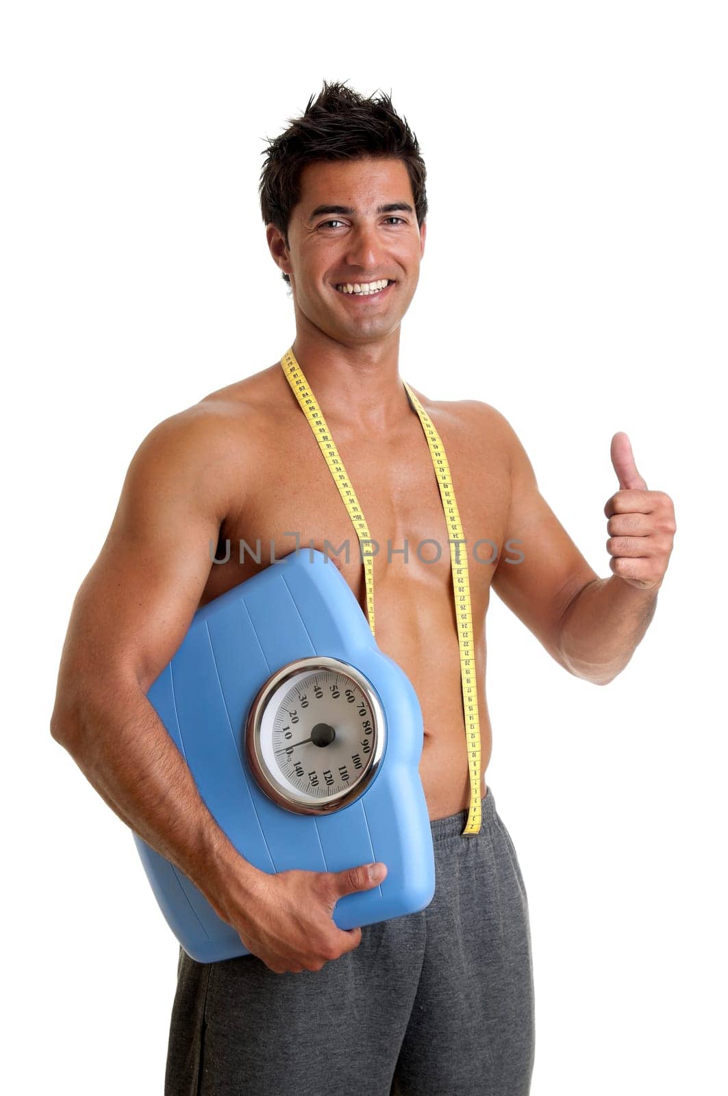 Muscular young man with weight scale