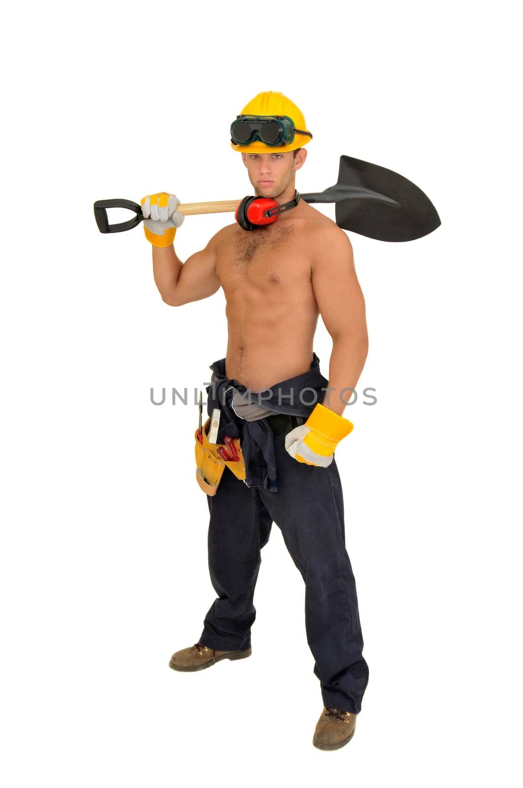 Muscular construction worker with shovel posing isolated in white