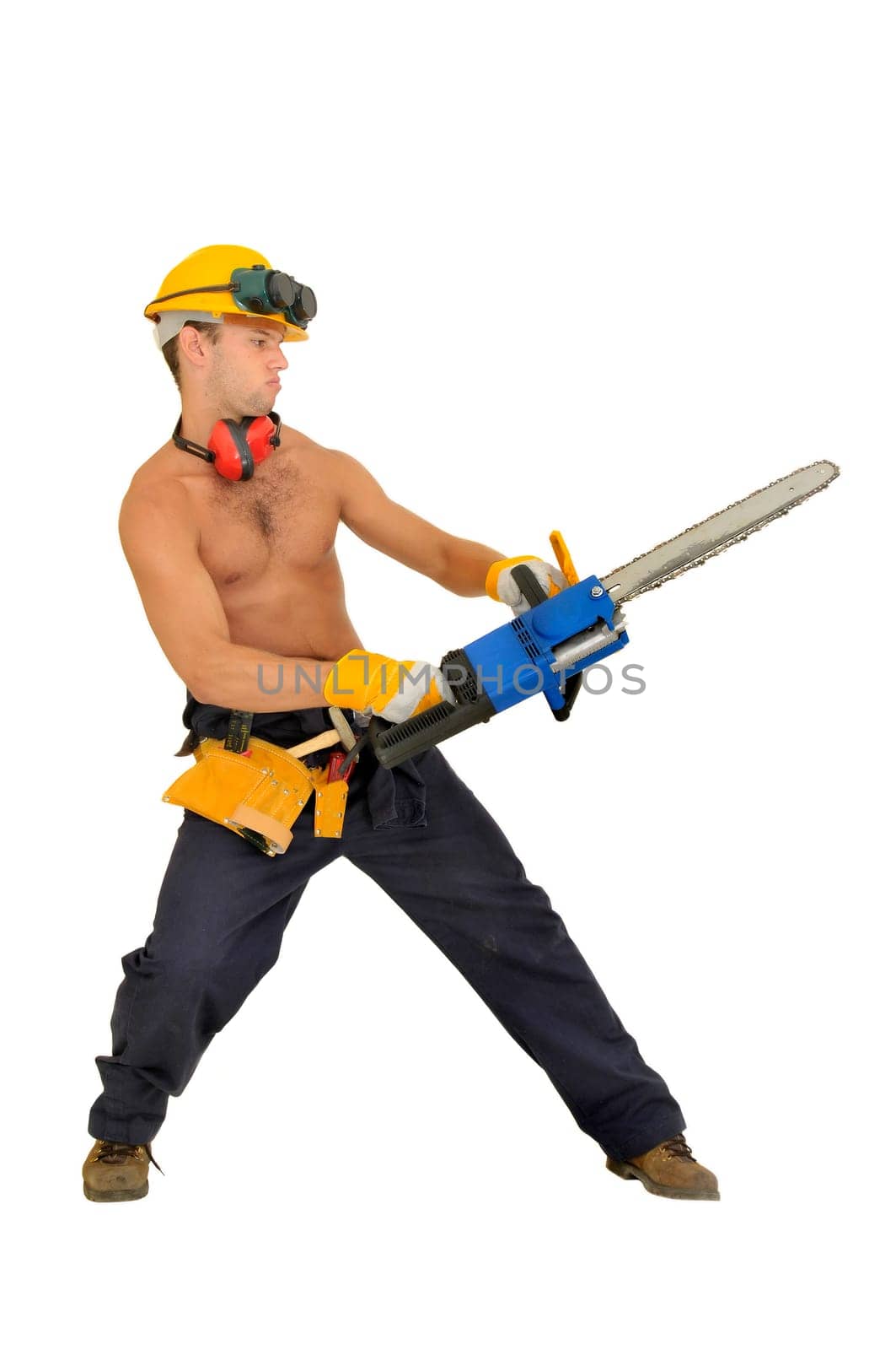 Muscular construction worker with chainsaw posing isolated in white