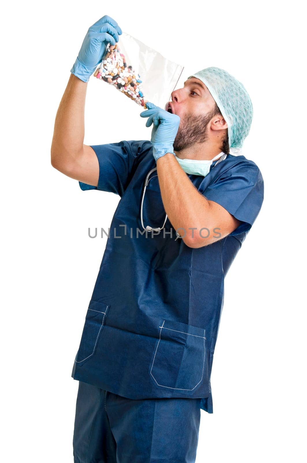 Doctor with pills against a white background