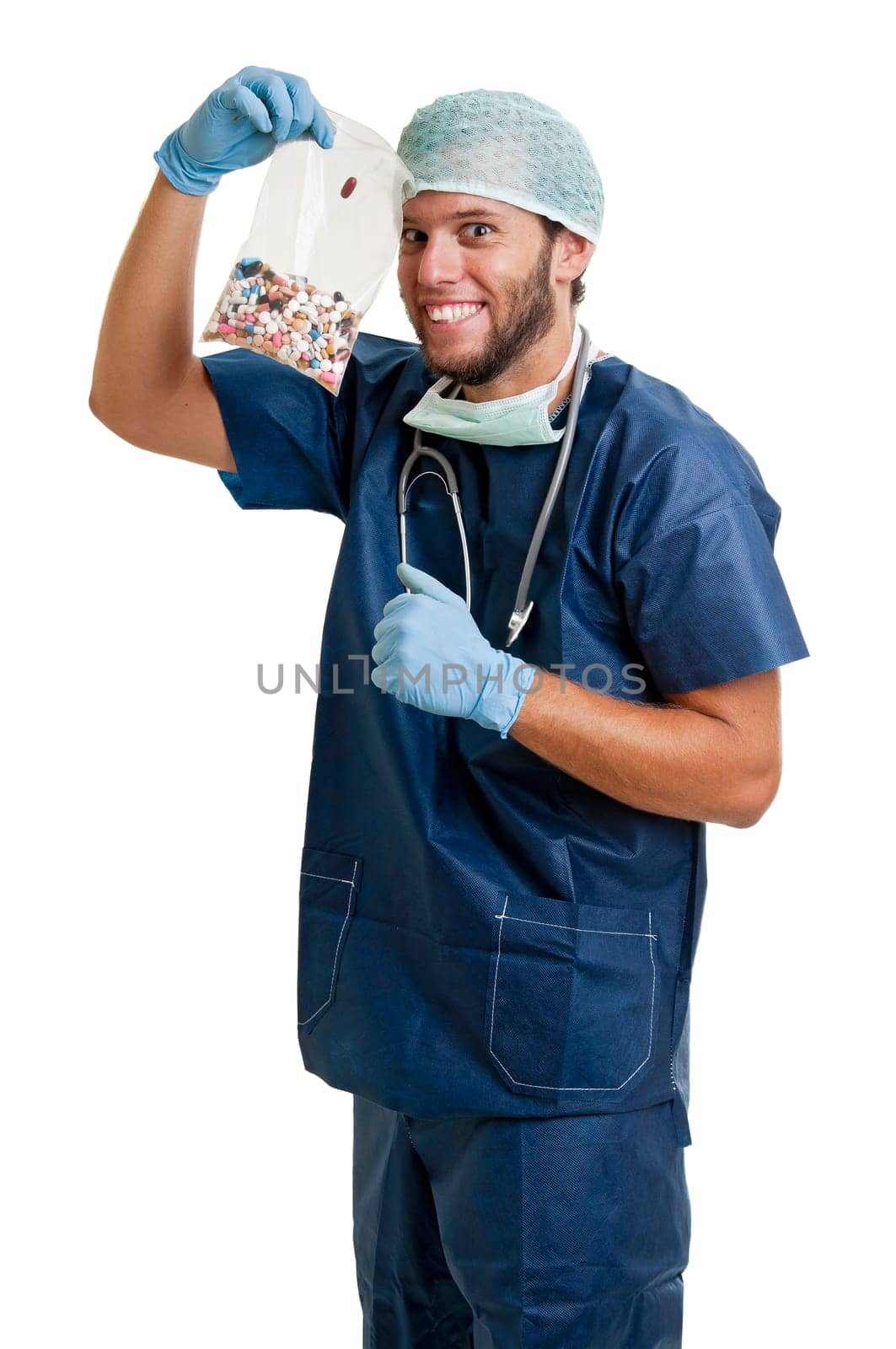 Doctor with pills against a white background