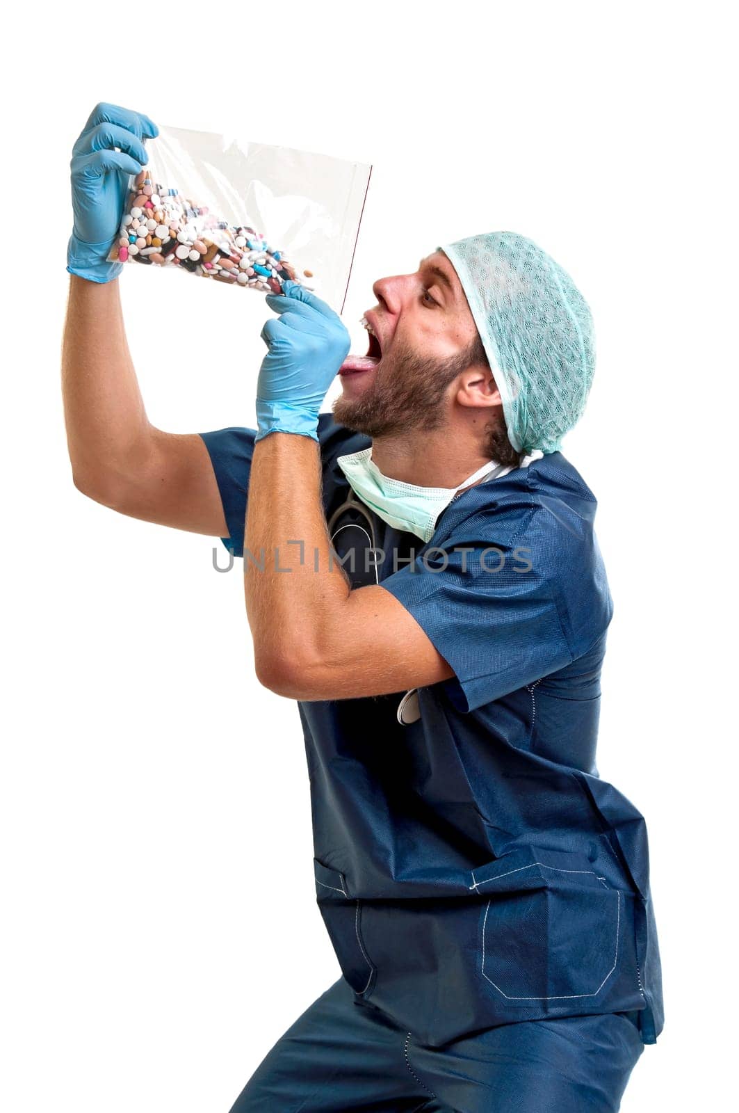 Doctor with pills against a white background