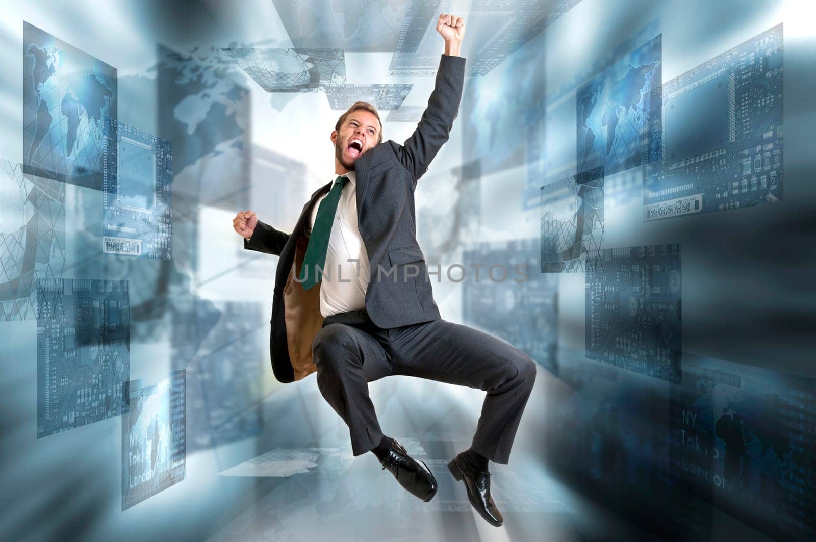 Young businessman jumping with digital screens all around
