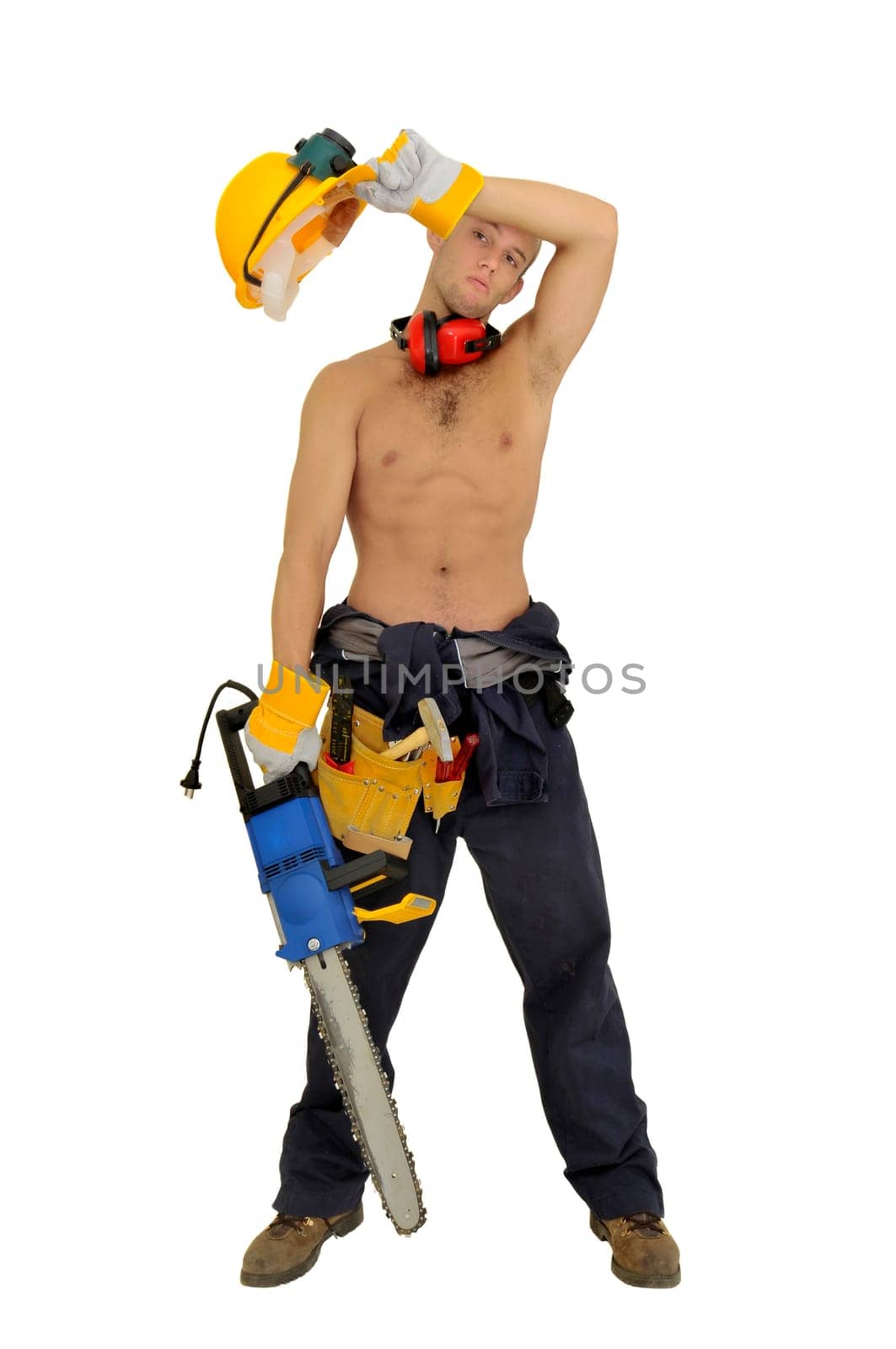 Muscular construction worker with chainsaw posing isolated in white