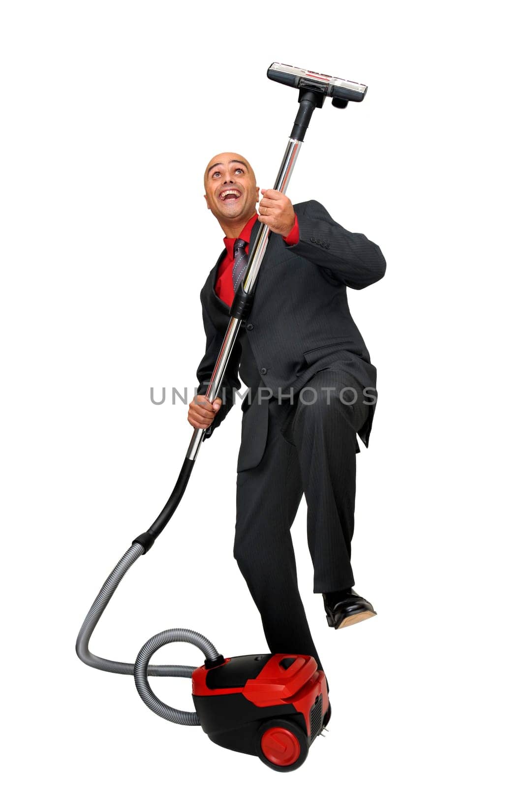 Businessman with vacuum cleaner isolated in white
