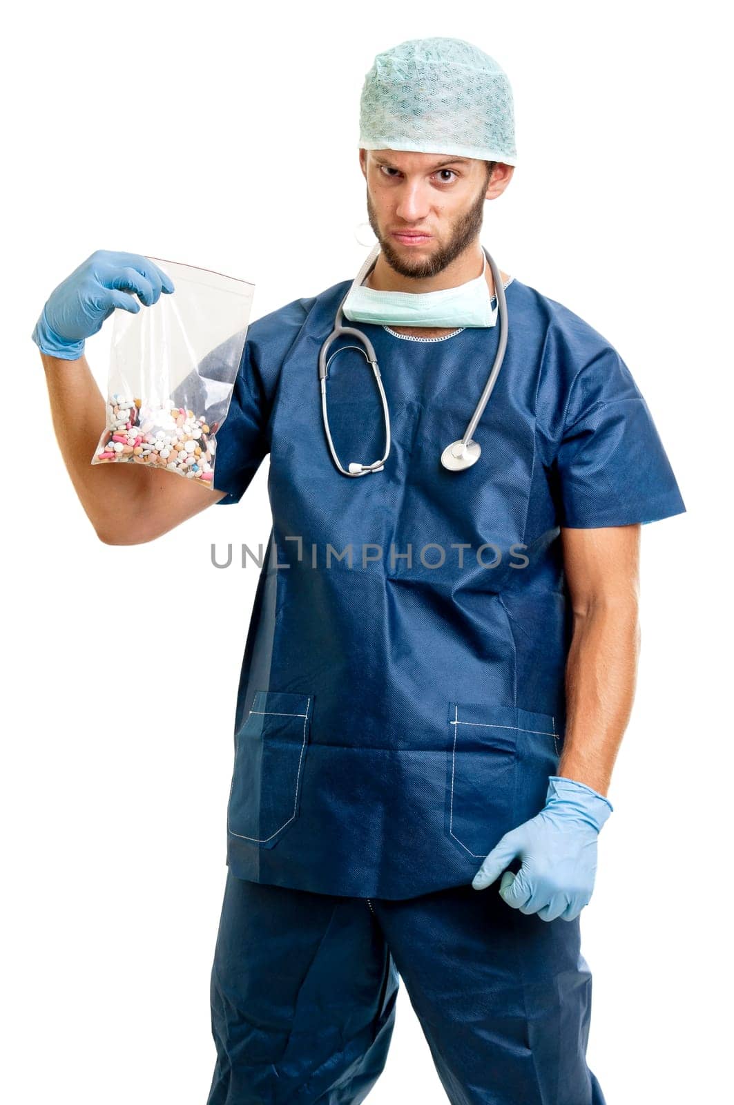 Doctor with pills against a white background