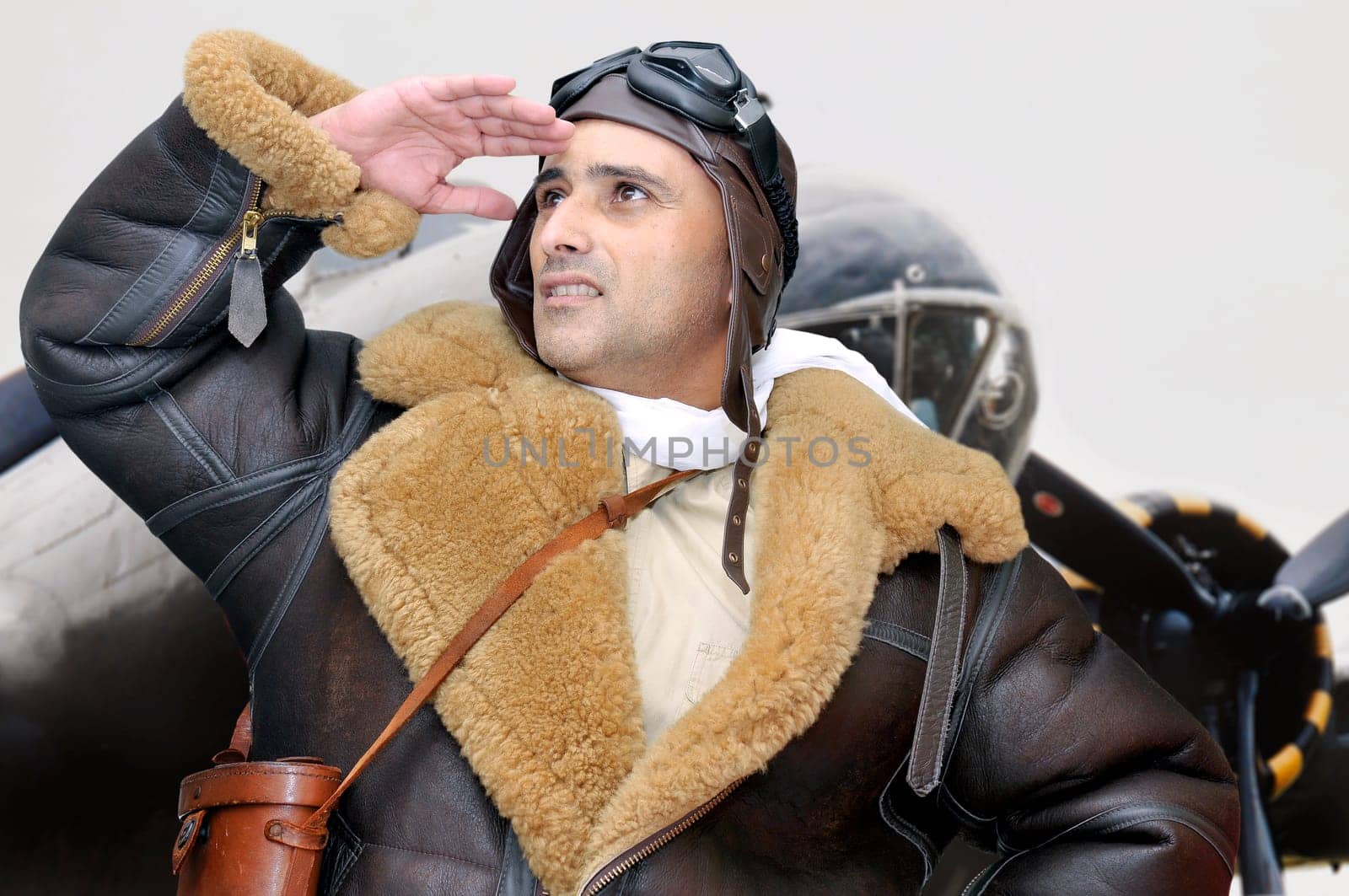 WWII figther pilot looking to the sky