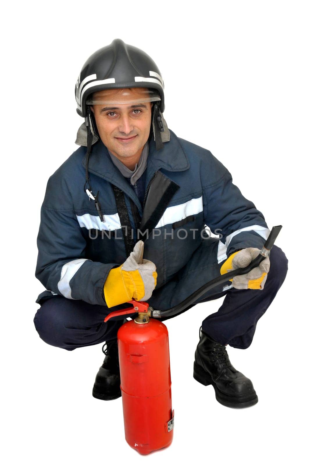 Fireman with extinguisher isolated in white