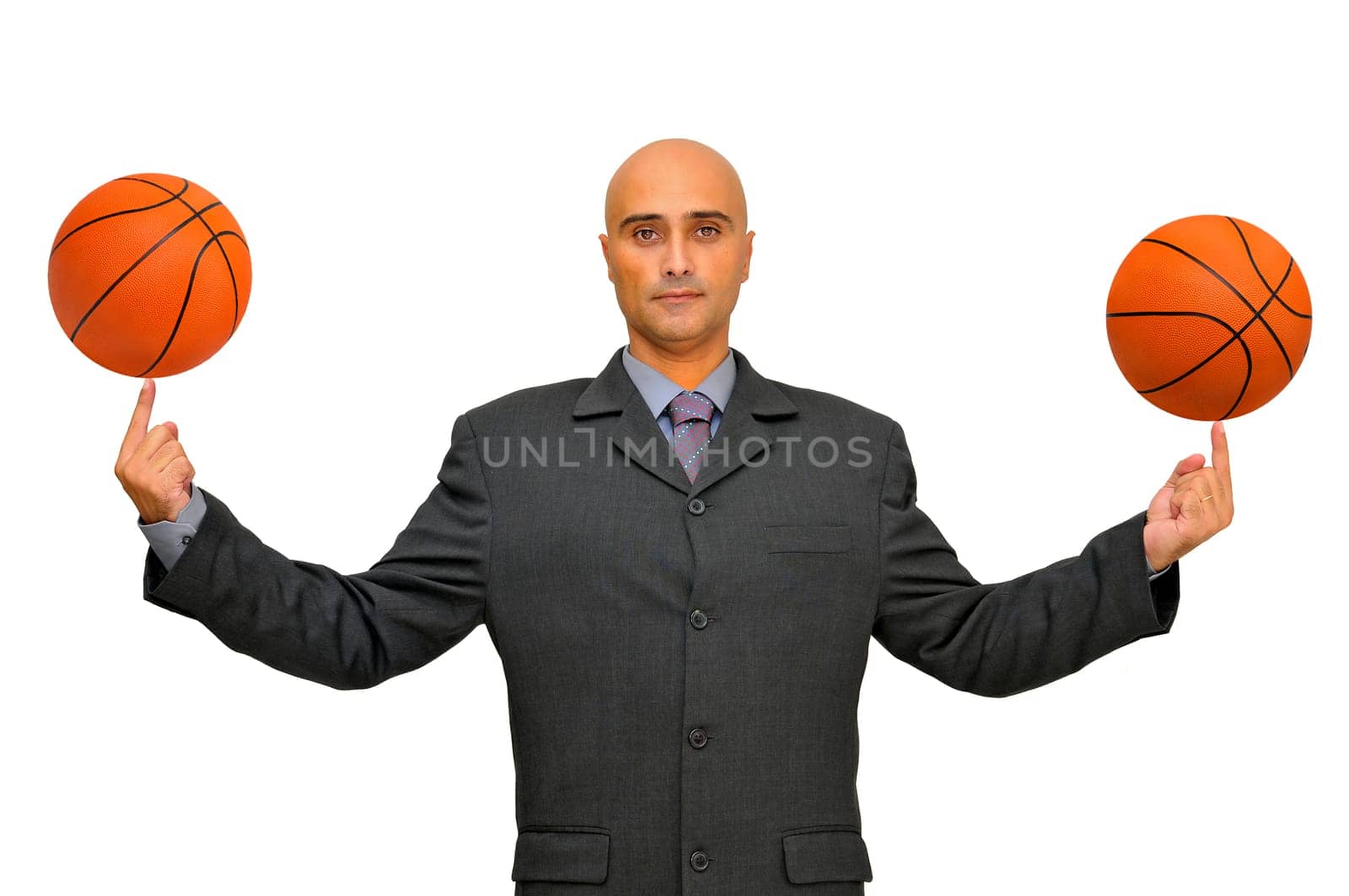 Businessman with several basketballs isolated in white