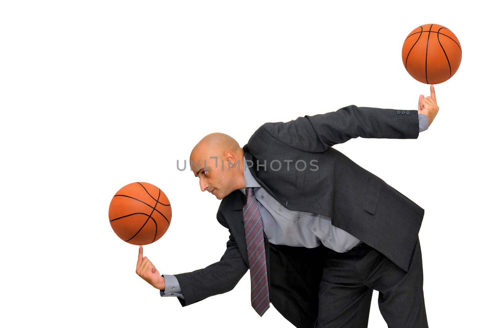 Businessman with several basketballs isolated in white