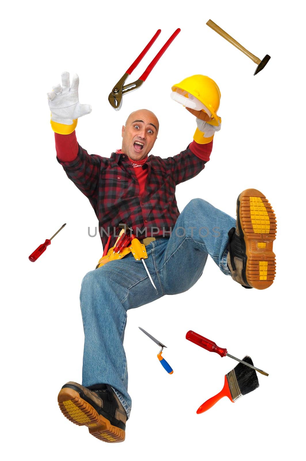 Construction worker falling with tools isolated in white
