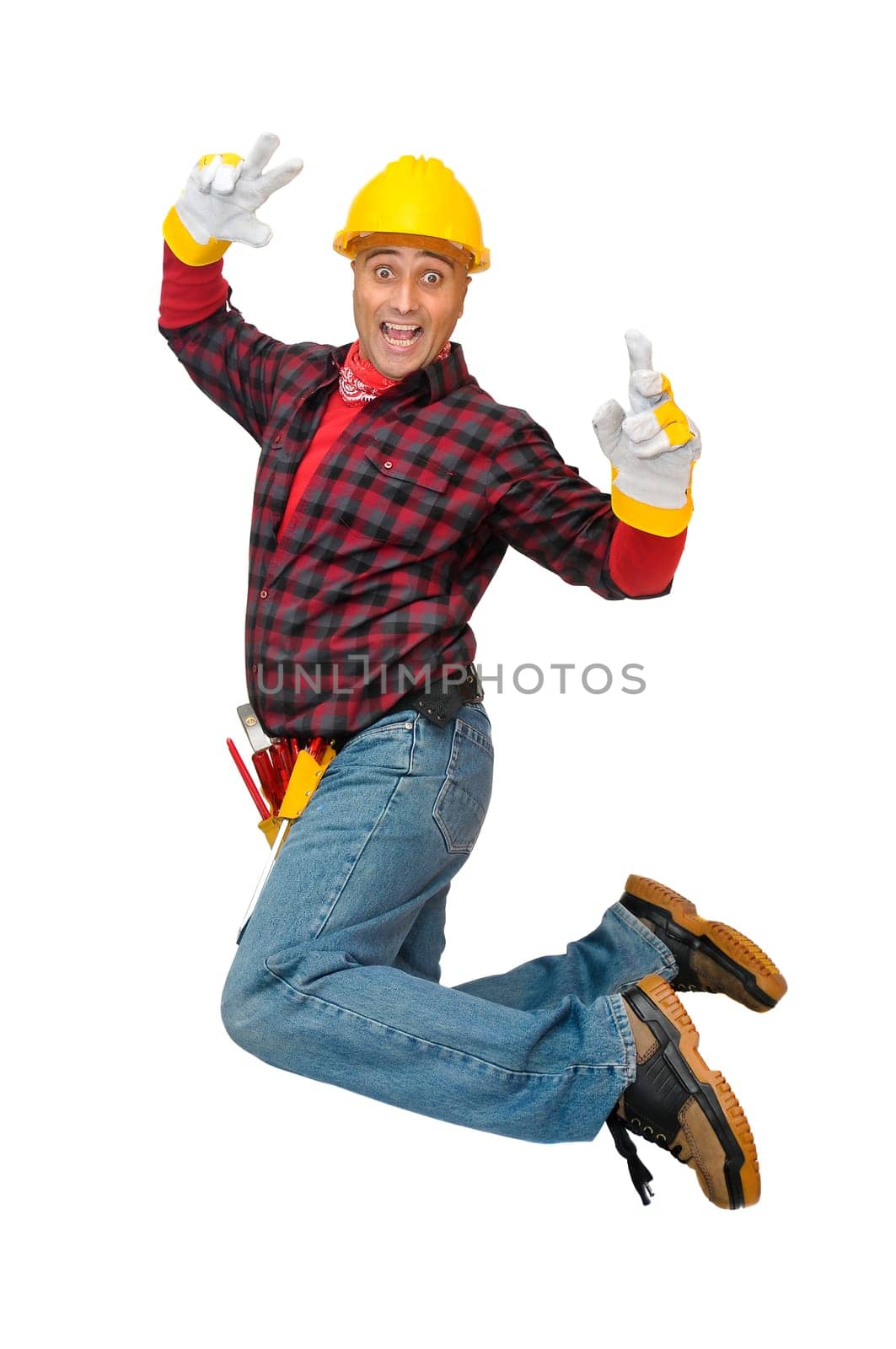 Happy construction worker jumping isolated in white