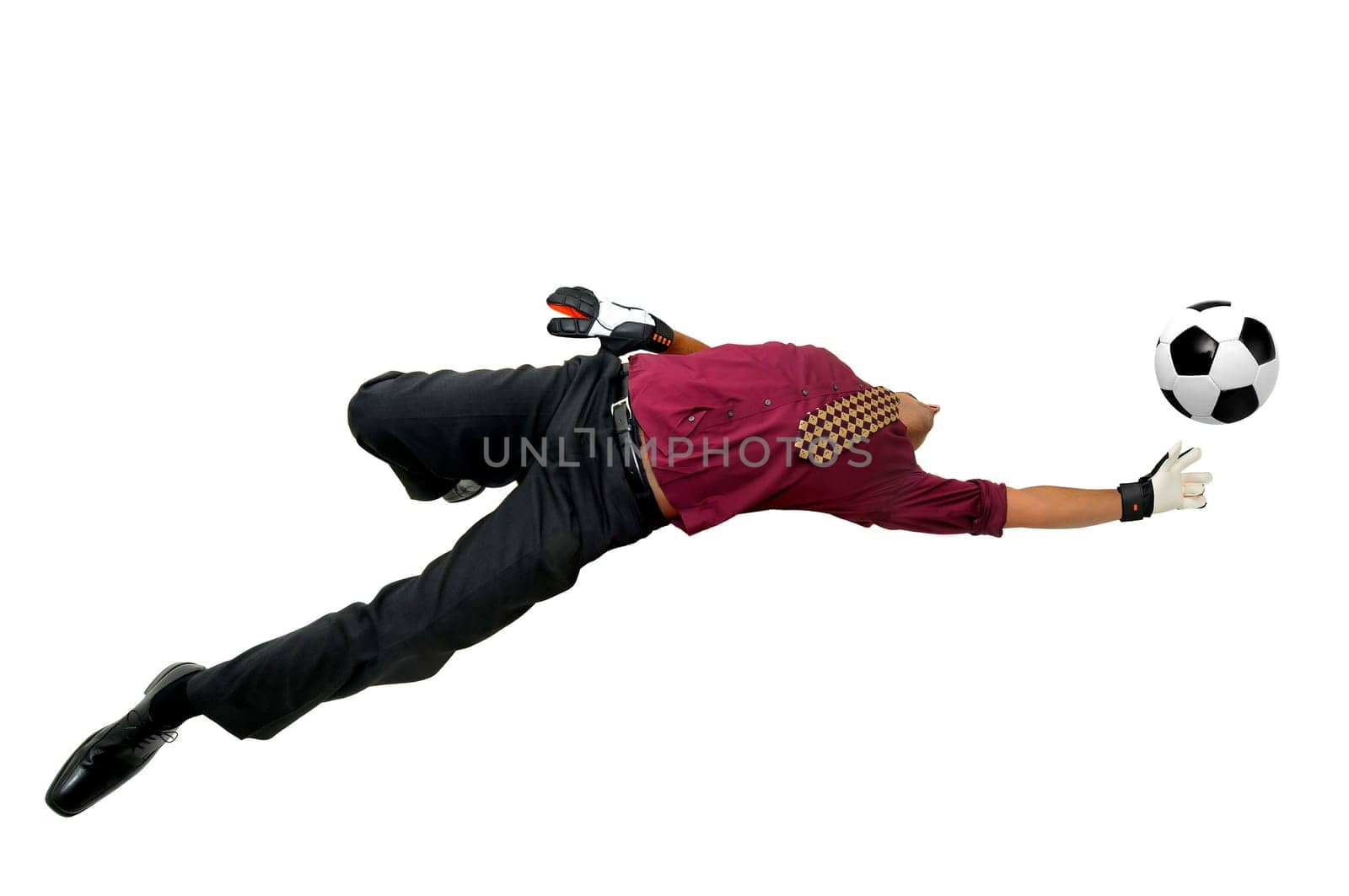 Businessman goalkeeper with gloves in a acrobatic pose with a soccer ball isolated in white
