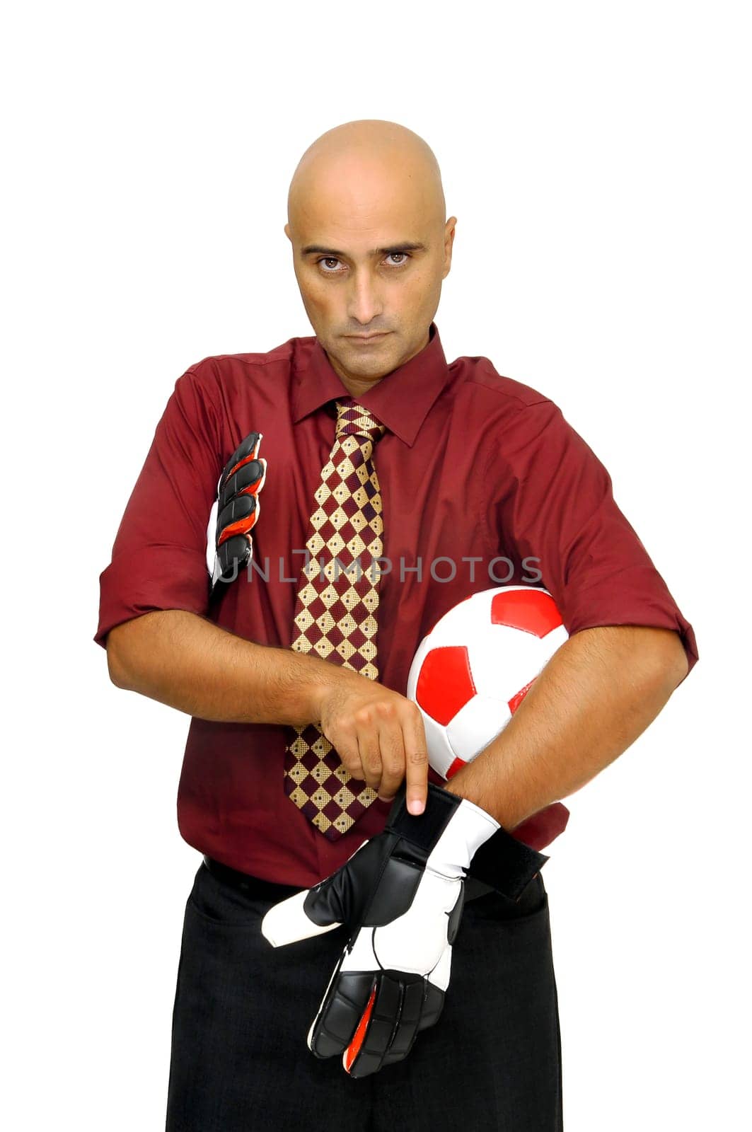 Businessman goalkeeper putting his gloves isolated in white