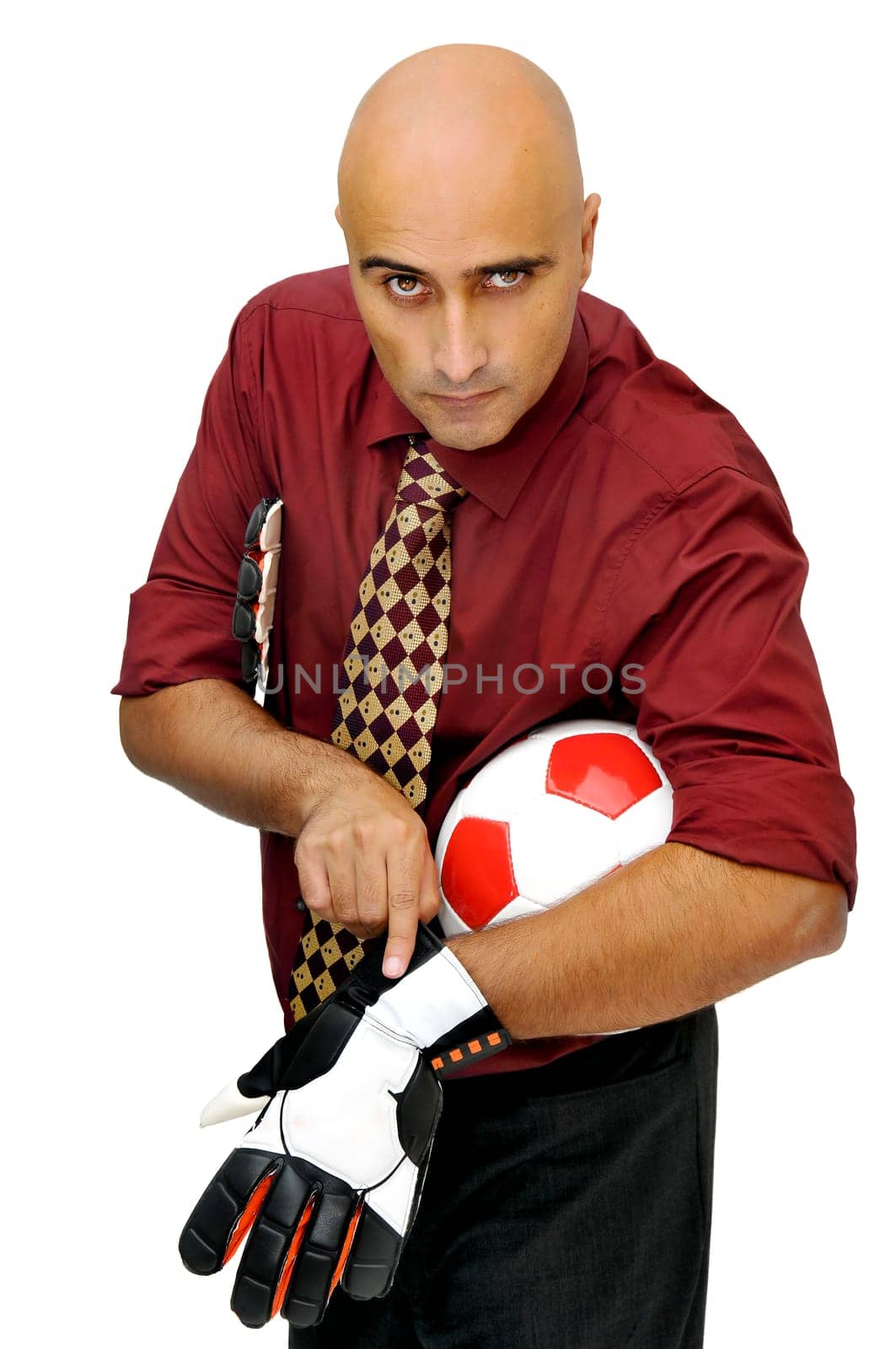 Businessman goalkeeper putting his gloves isolated in white