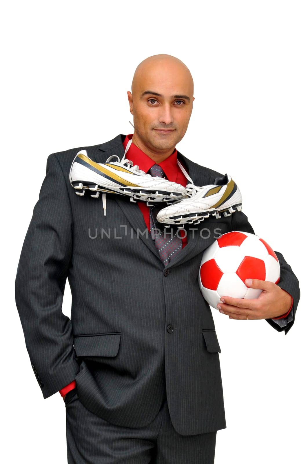 Businessman with soccer ball isolated in white