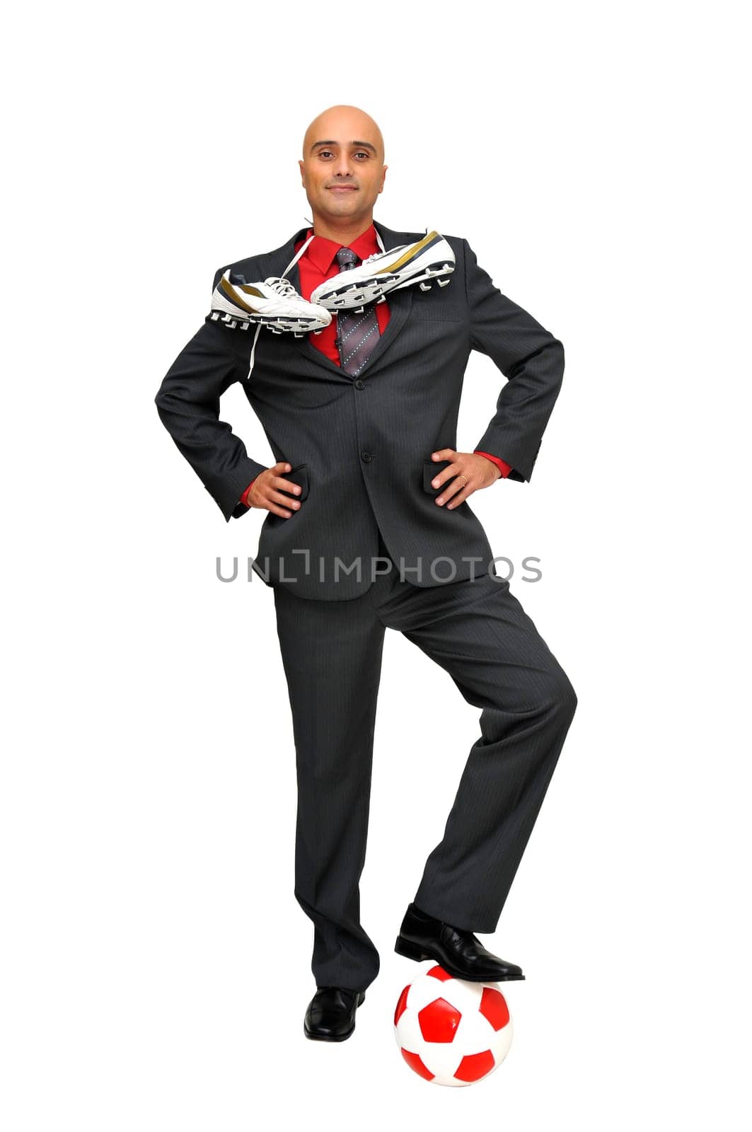 Businessman with a soccer ball isolated in white