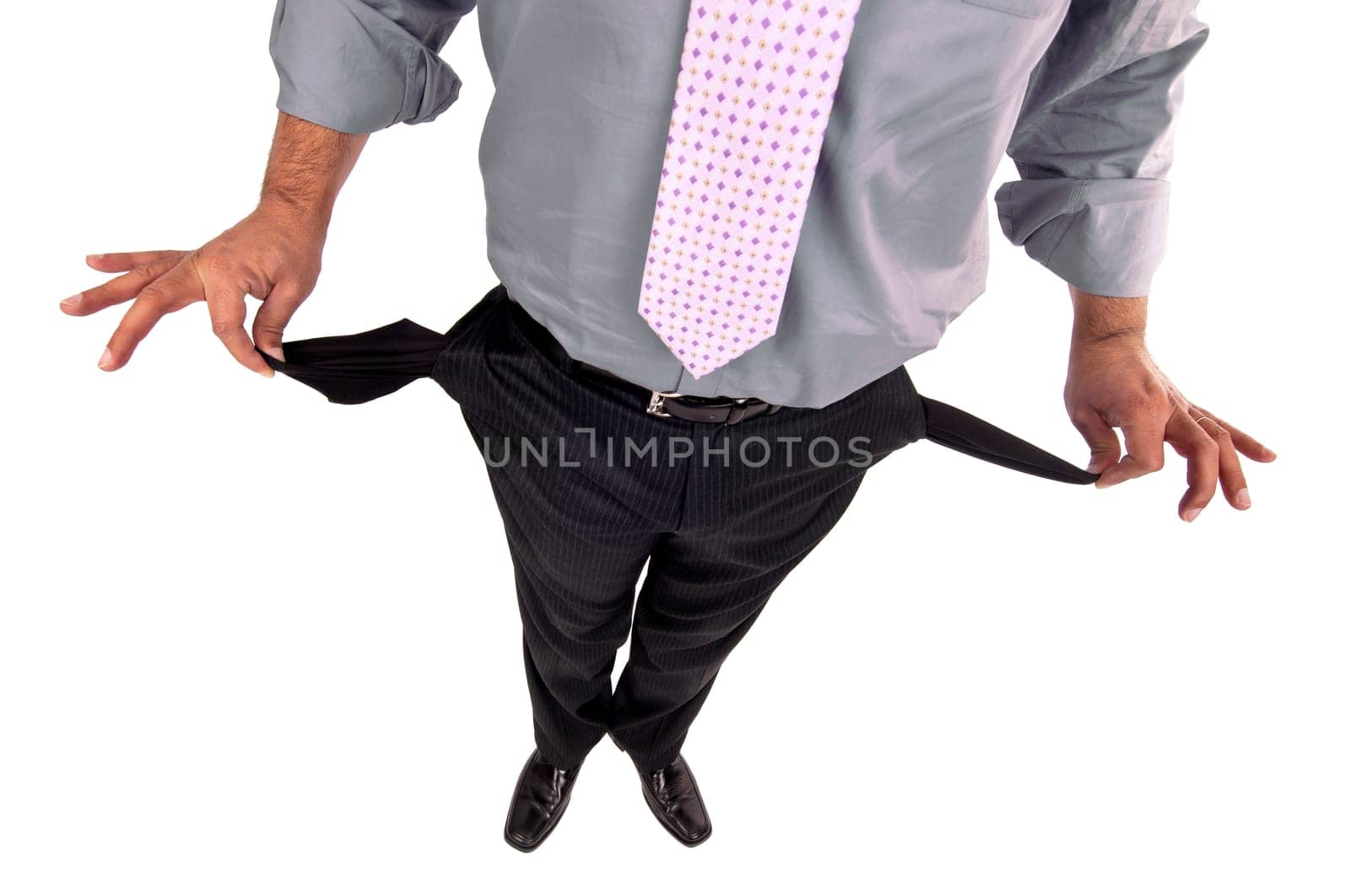 Man's bodypart showing empty pockets isolated in white