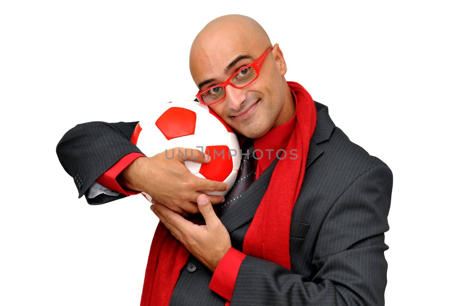 Businessman with soccer ball isolated in white