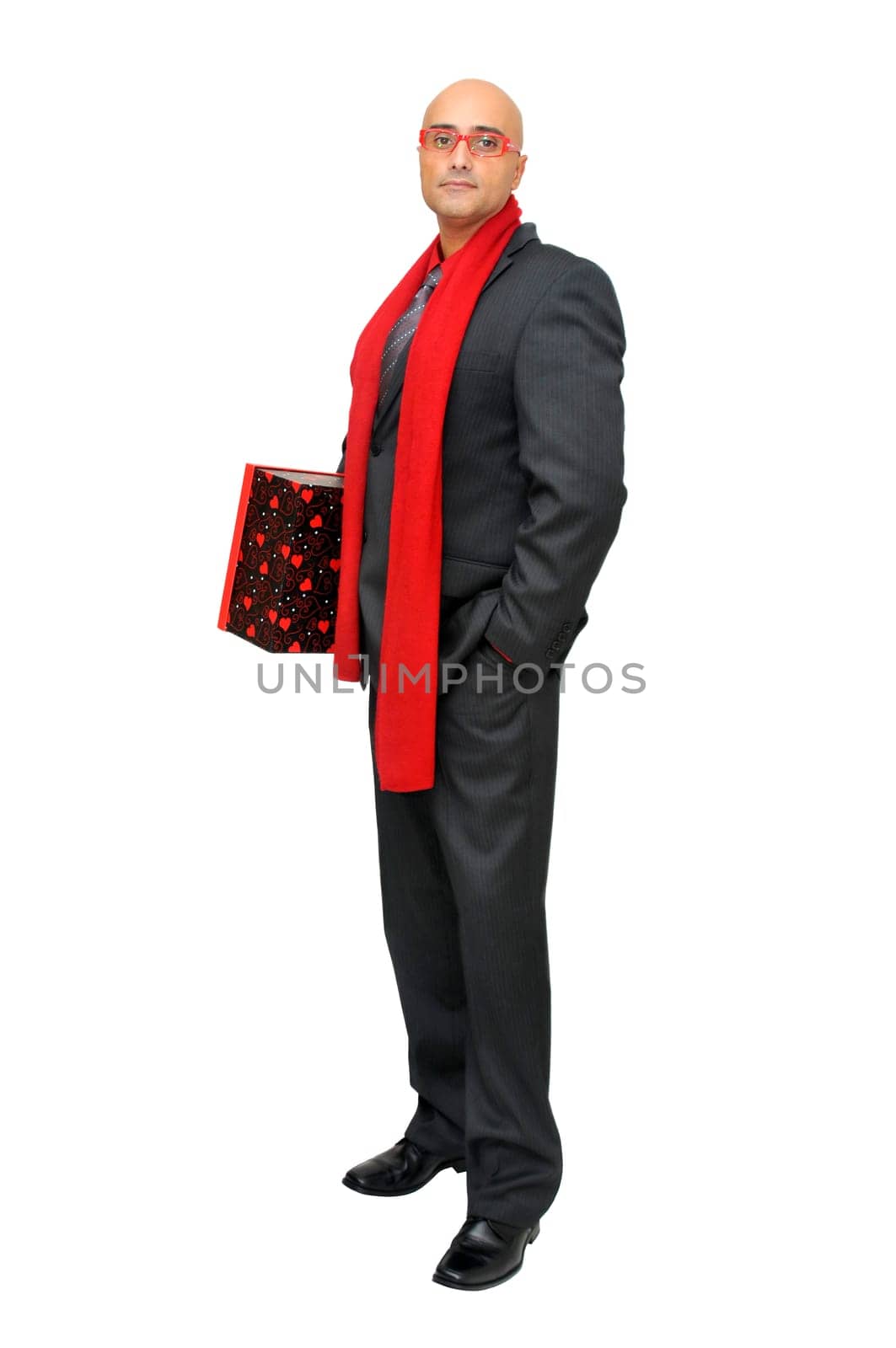 Businessman with gift isolated against a white background