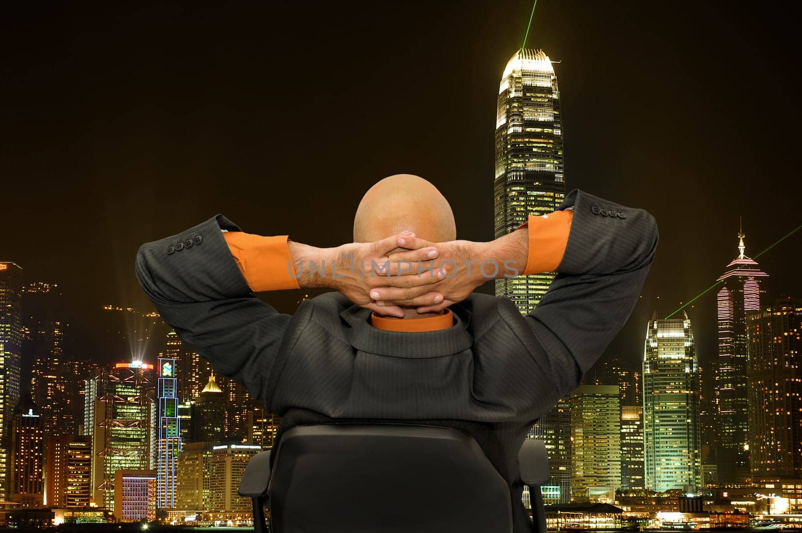 Mature businessman in a chair isolated in white