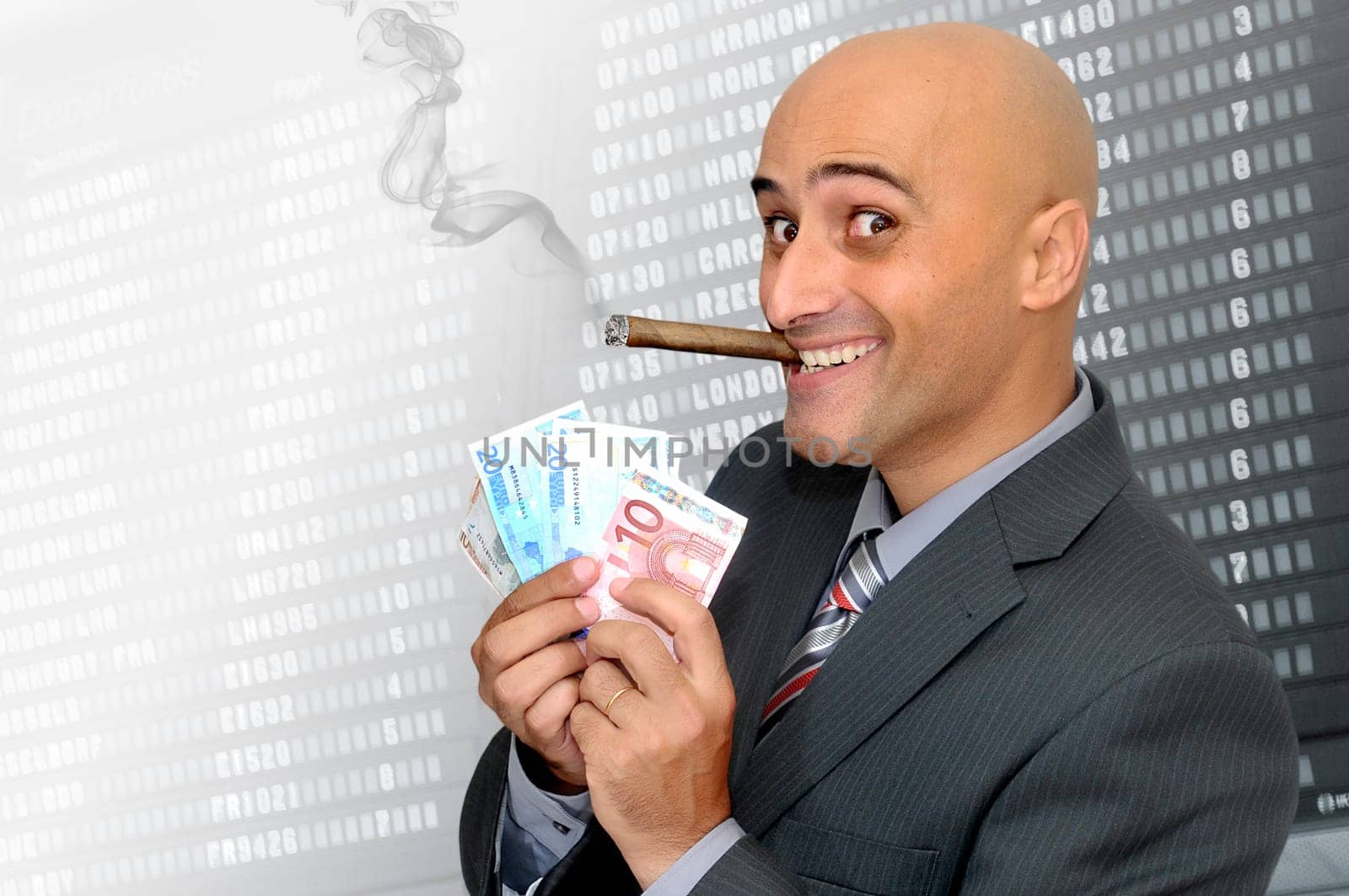 Businessman with money and a cigar