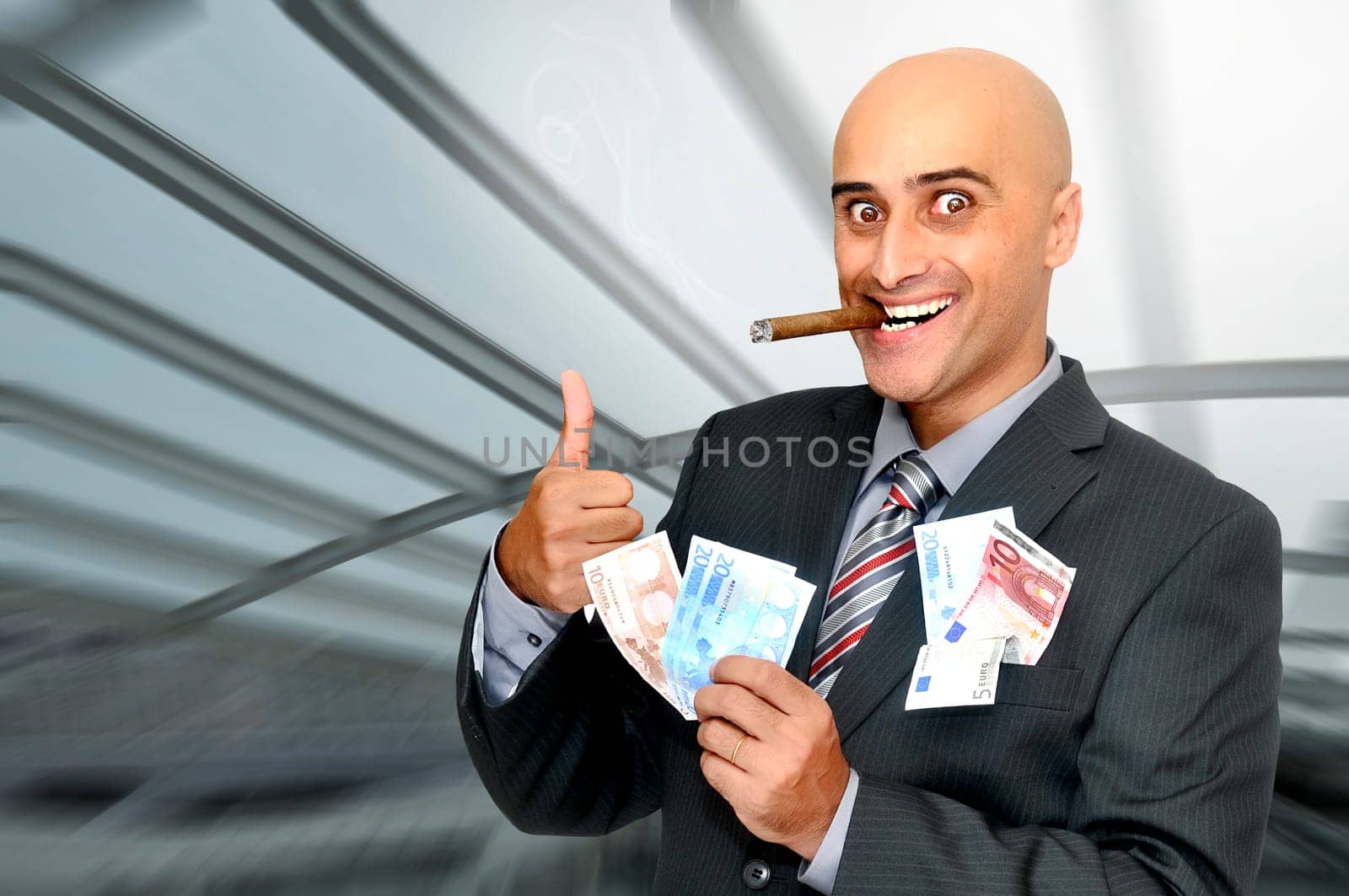 Businessman with money and a cigar