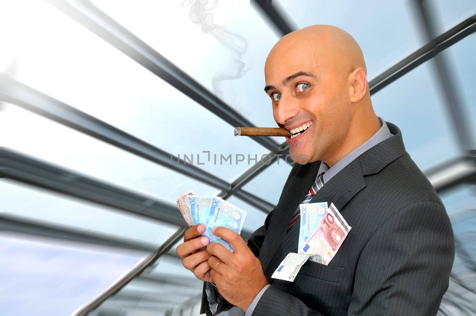 Businessman with money and a cigar