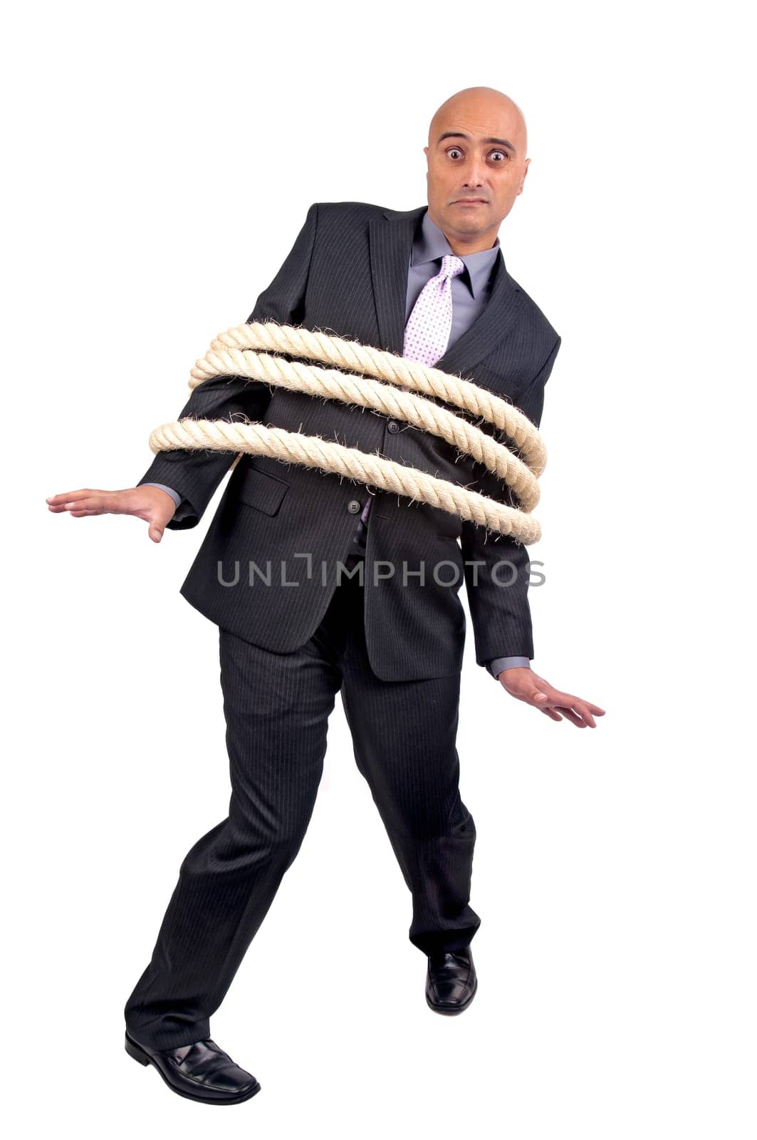 Businessman tied with a large rope