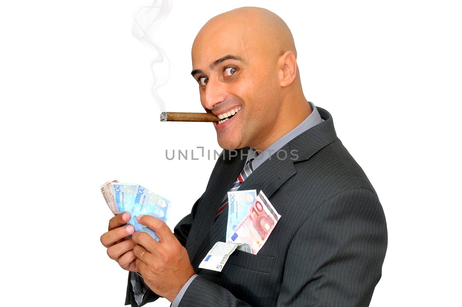 Businessman with money and a cigar isolated in white