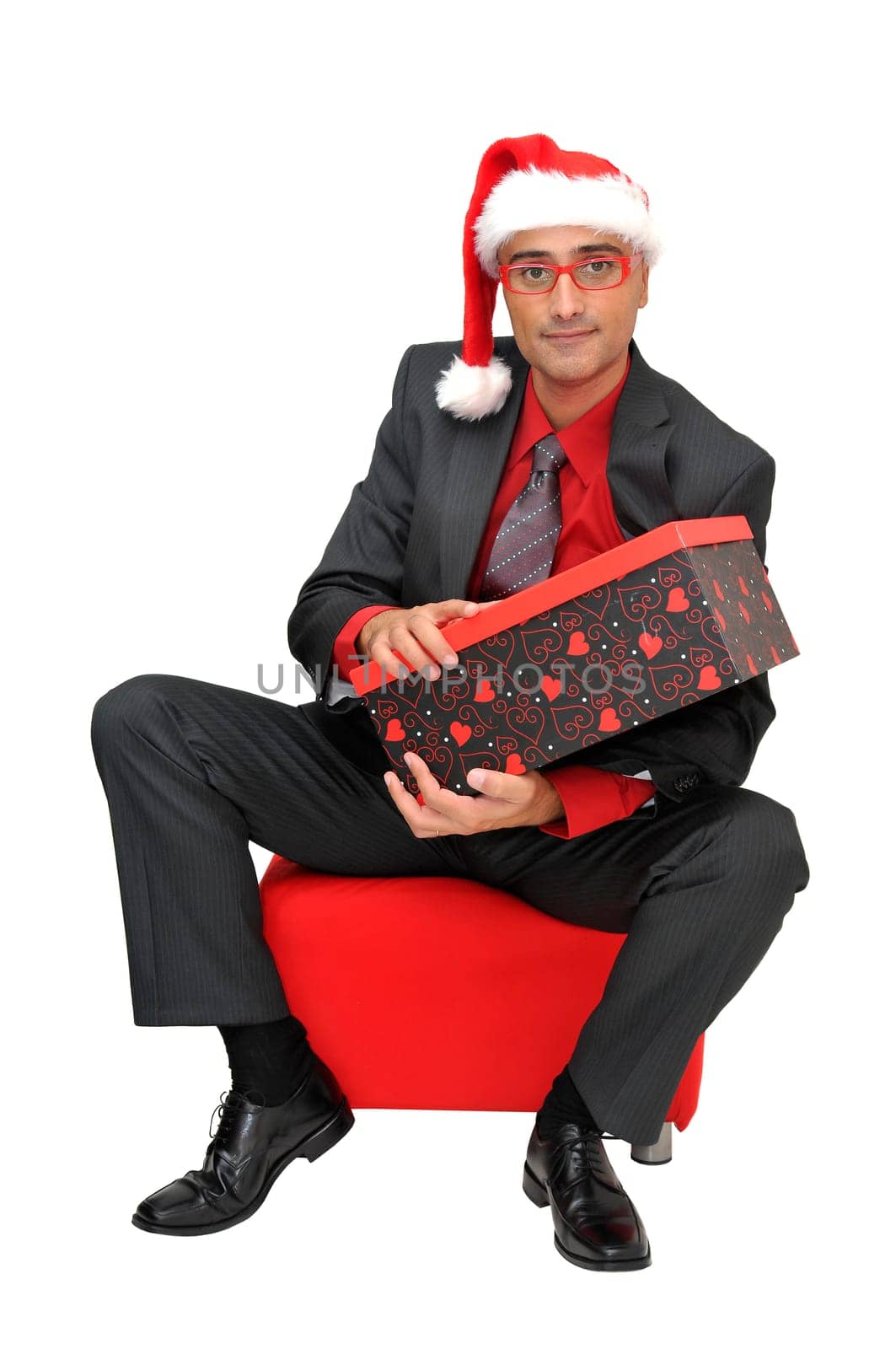 Businessman with gift isolated against a white background
