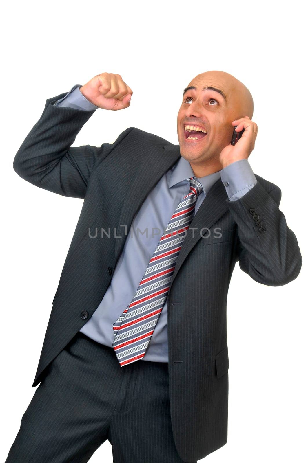 Happy businessman with cellphone