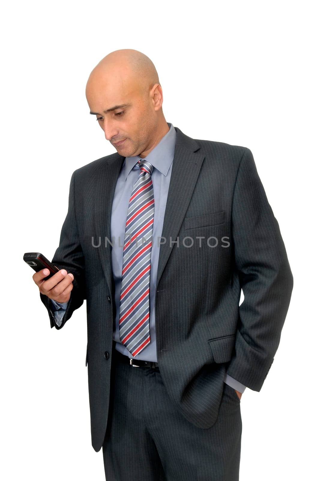 Businessman with cellphone isolated in white