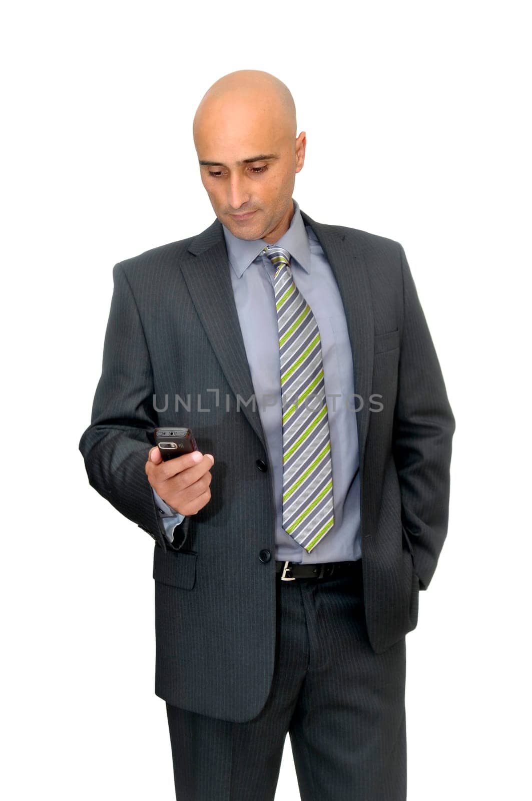 Businessman with cellphone isolated in white