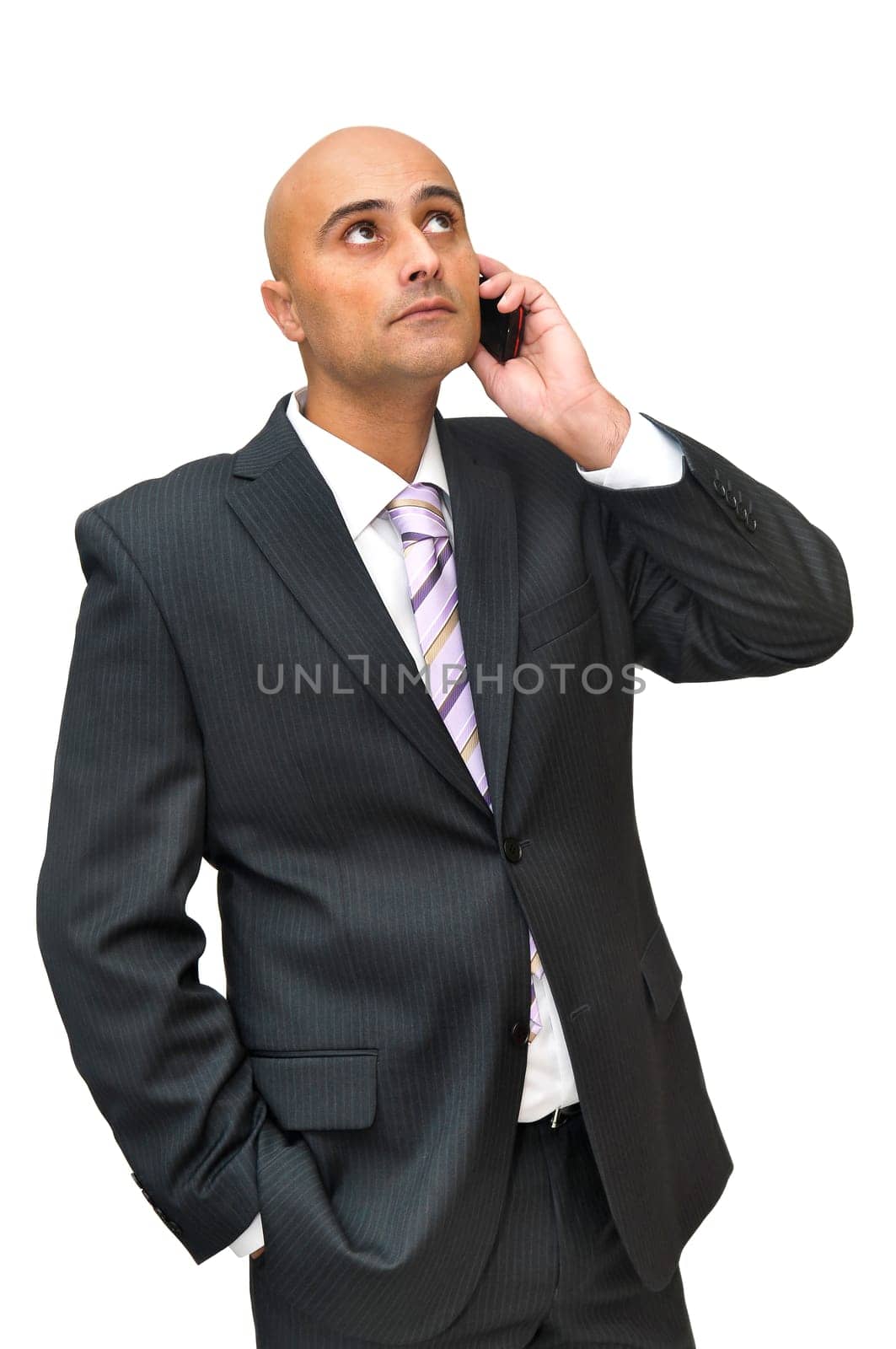 Businessman with cellphone isolated in white