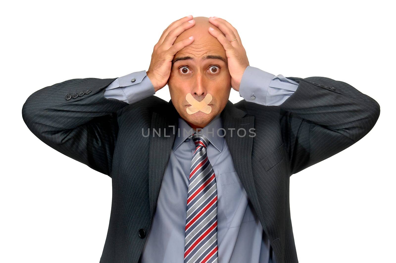 Distressed businessman with band aid in his mouth isolated in white
