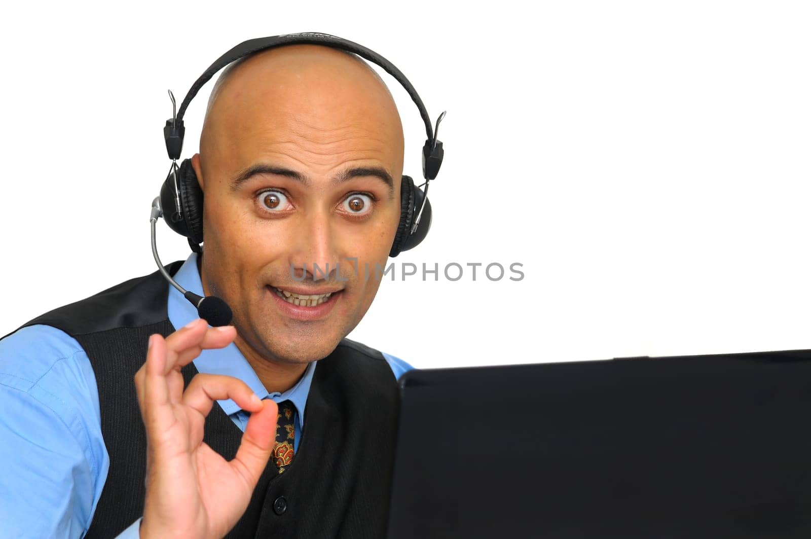 Businessman with headset and laptop isolated in white
