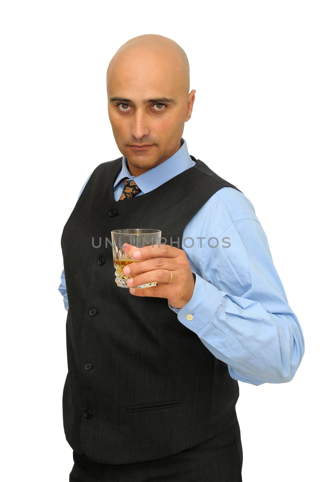 Businessman with a glass of whisky isolated in white