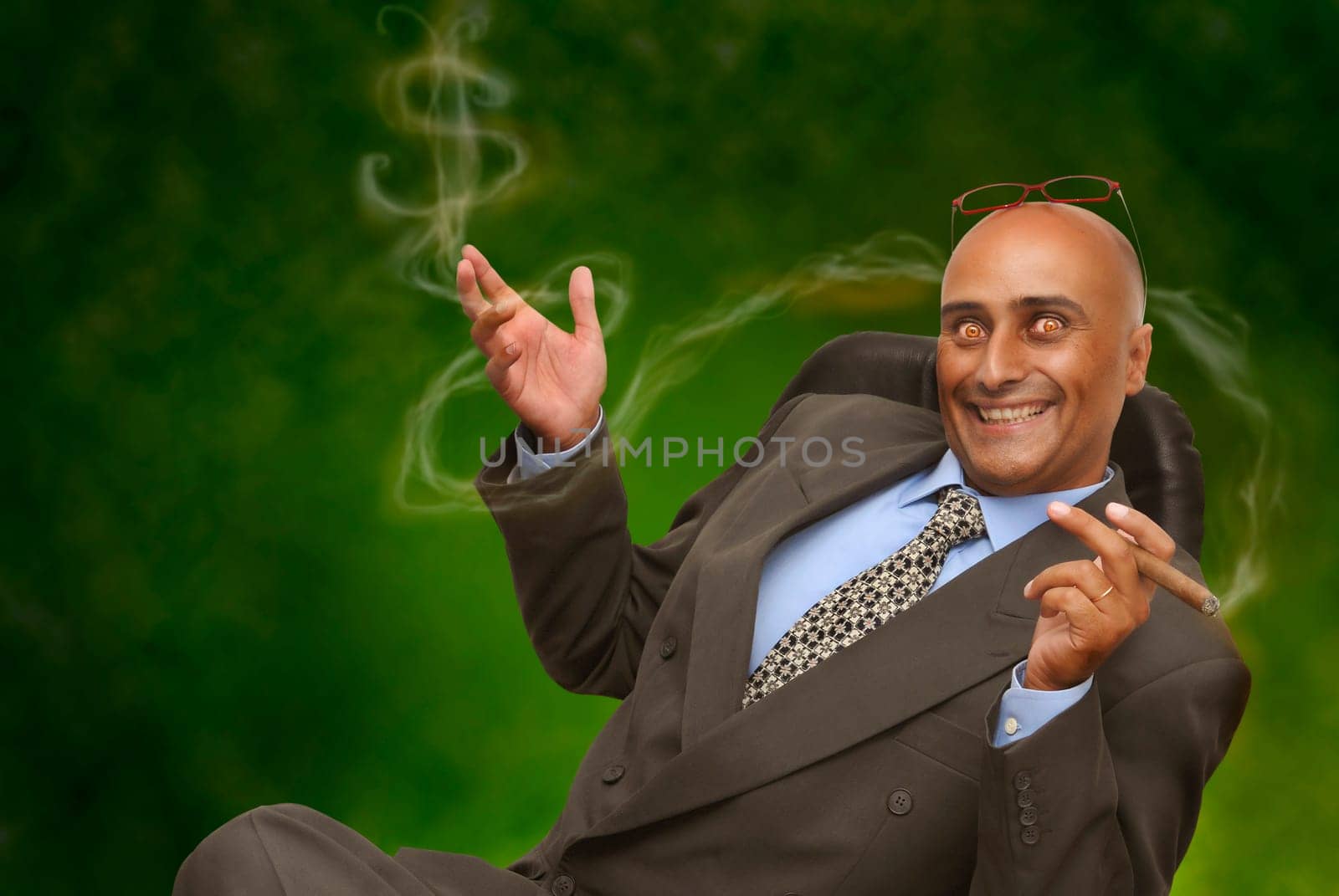 Devilish businessman in green background
