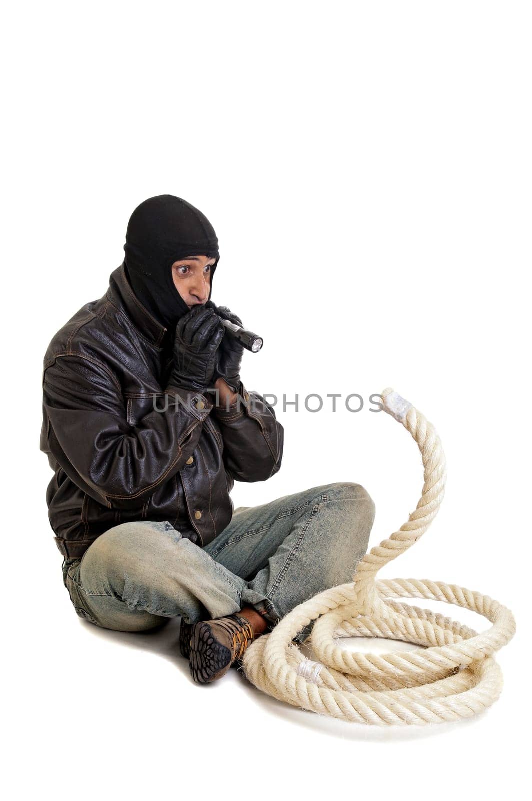 Burglar wiht flashlight and rope isolated in white