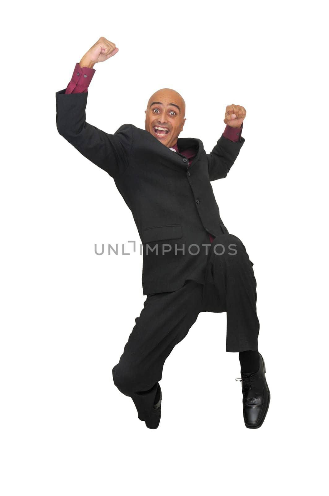 Happy businessman jumping against a white background