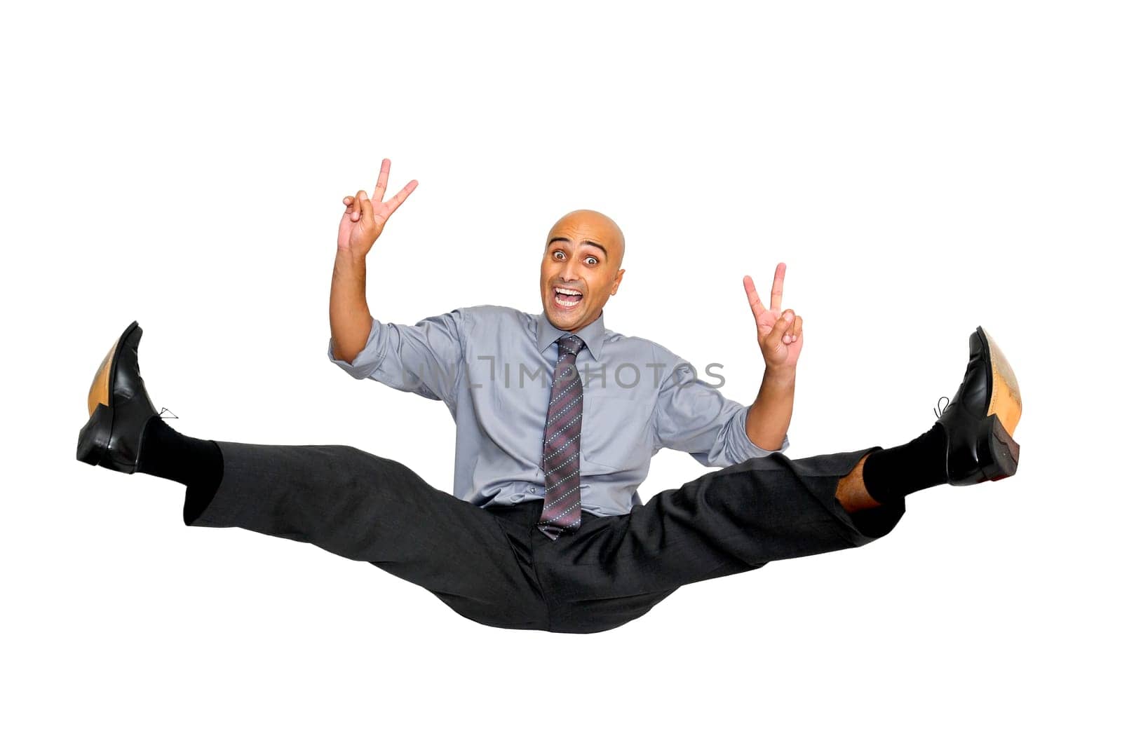 Happy businessman jumping high isolated in white