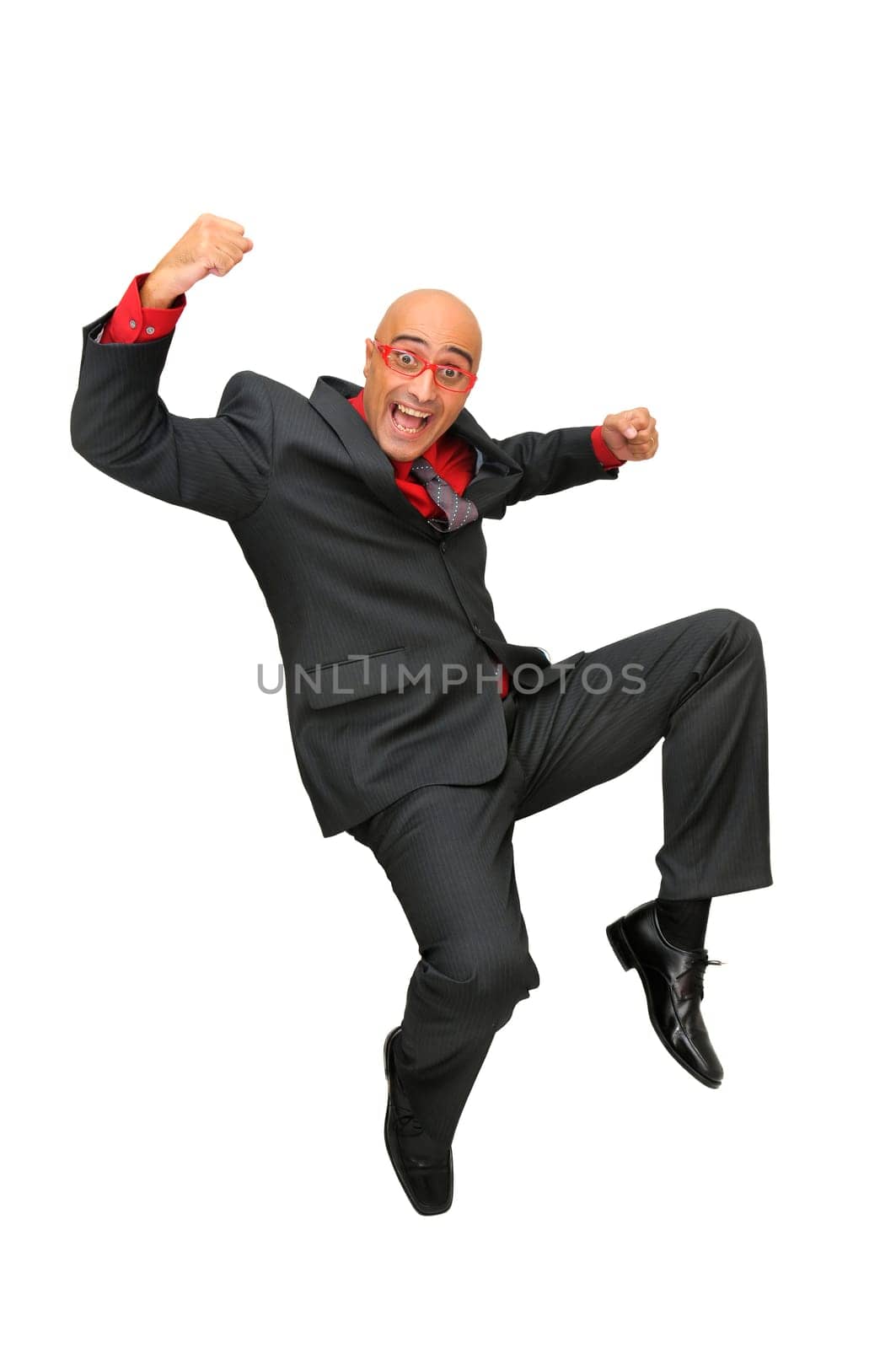 Happy businessman jumping high isolated in white