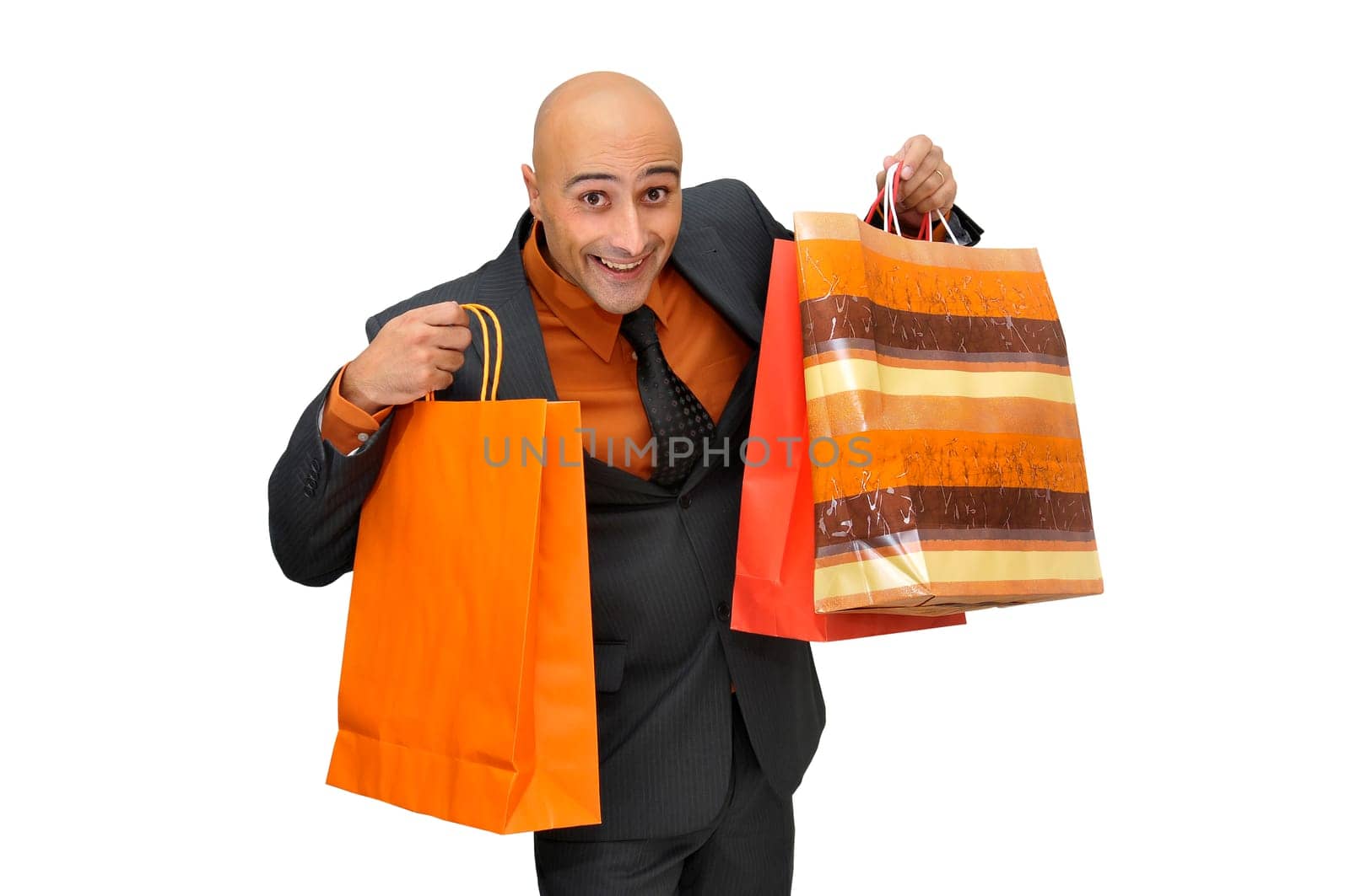 Elegant businessman with shopping bags isolated in white