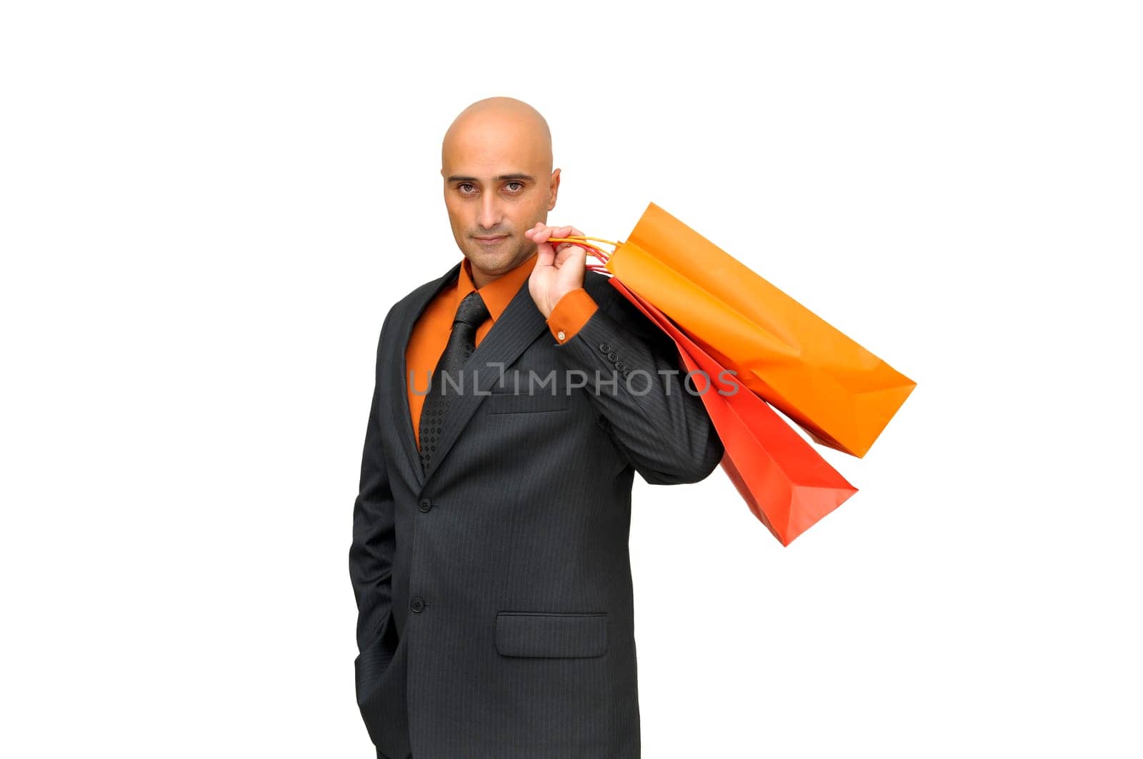 Elegant businessman with shopping bags isolated in white